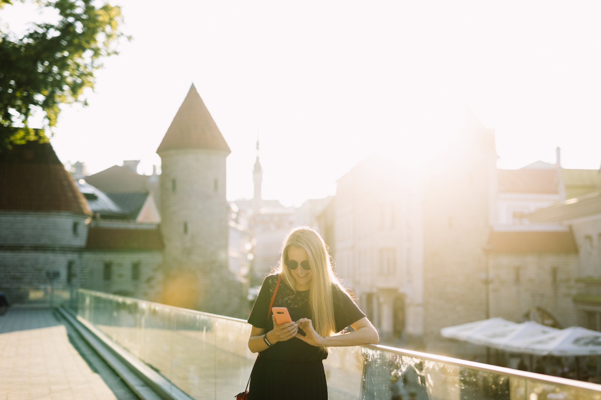 women on a phone in Tallinn old town