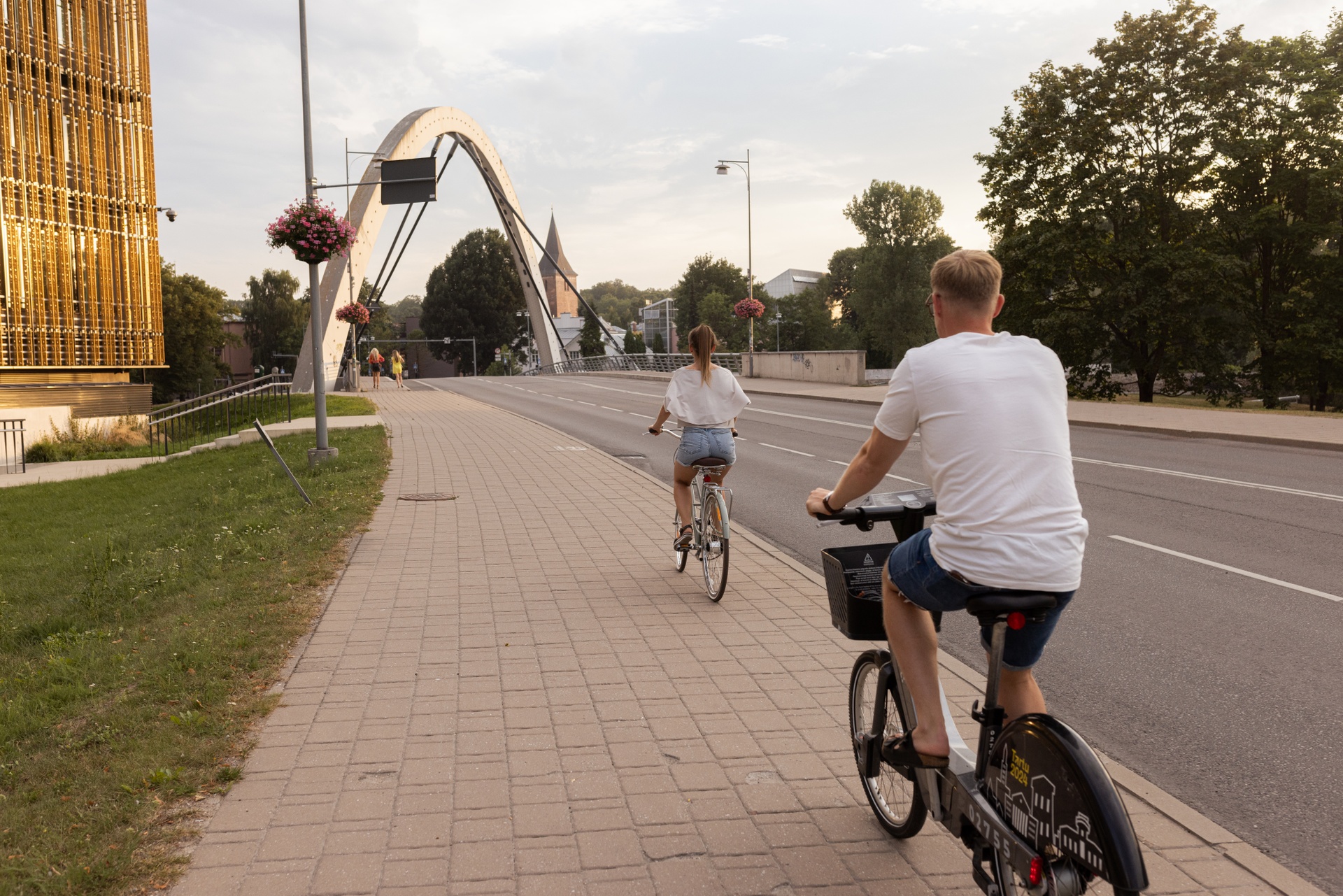 A man and woman riding bikes in Tartu, Estonia