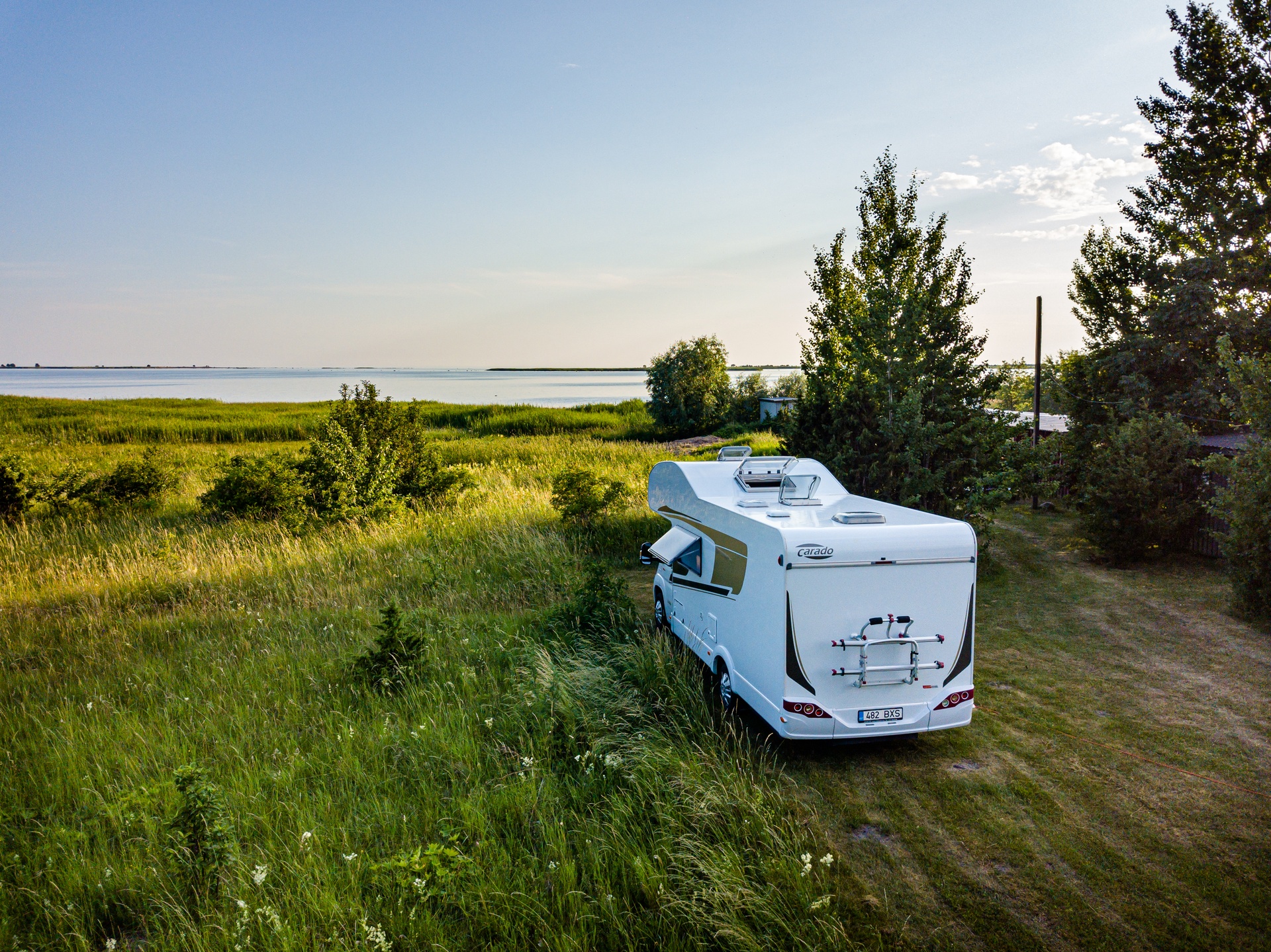 Caravan parked facing the sea during summer in Estonia