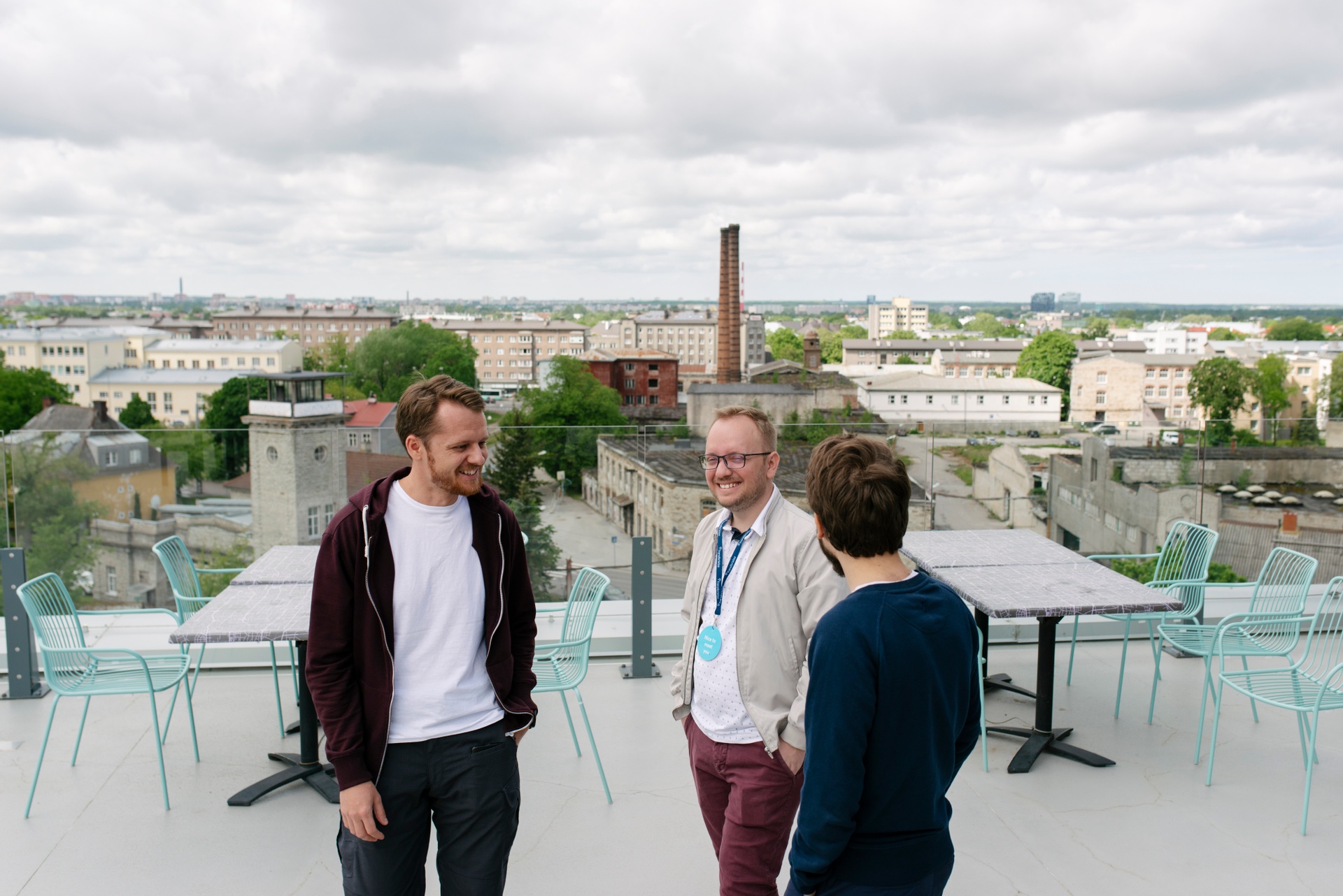 Men talking on rooftop