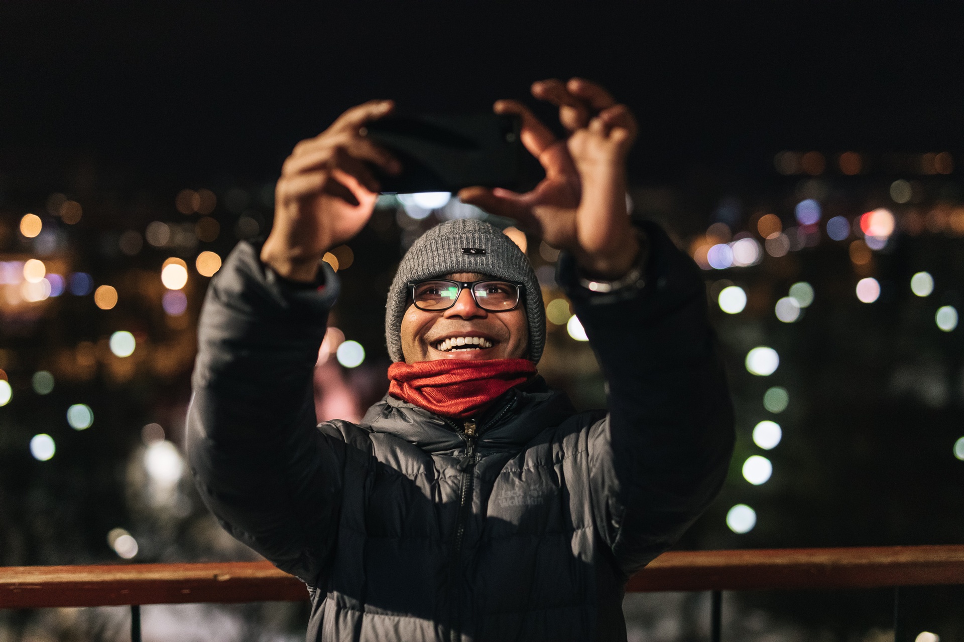 Man taking selfie at night in Tallinn