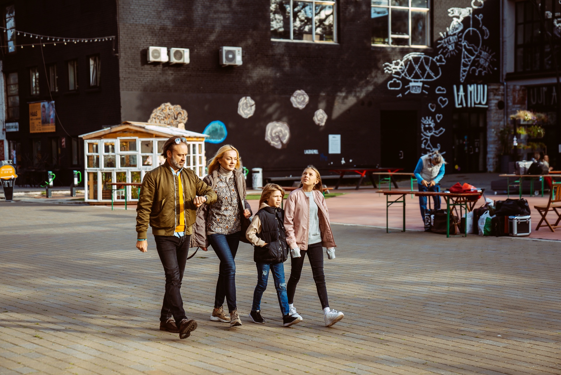 Family walking in Tallinn's Telliskivi area