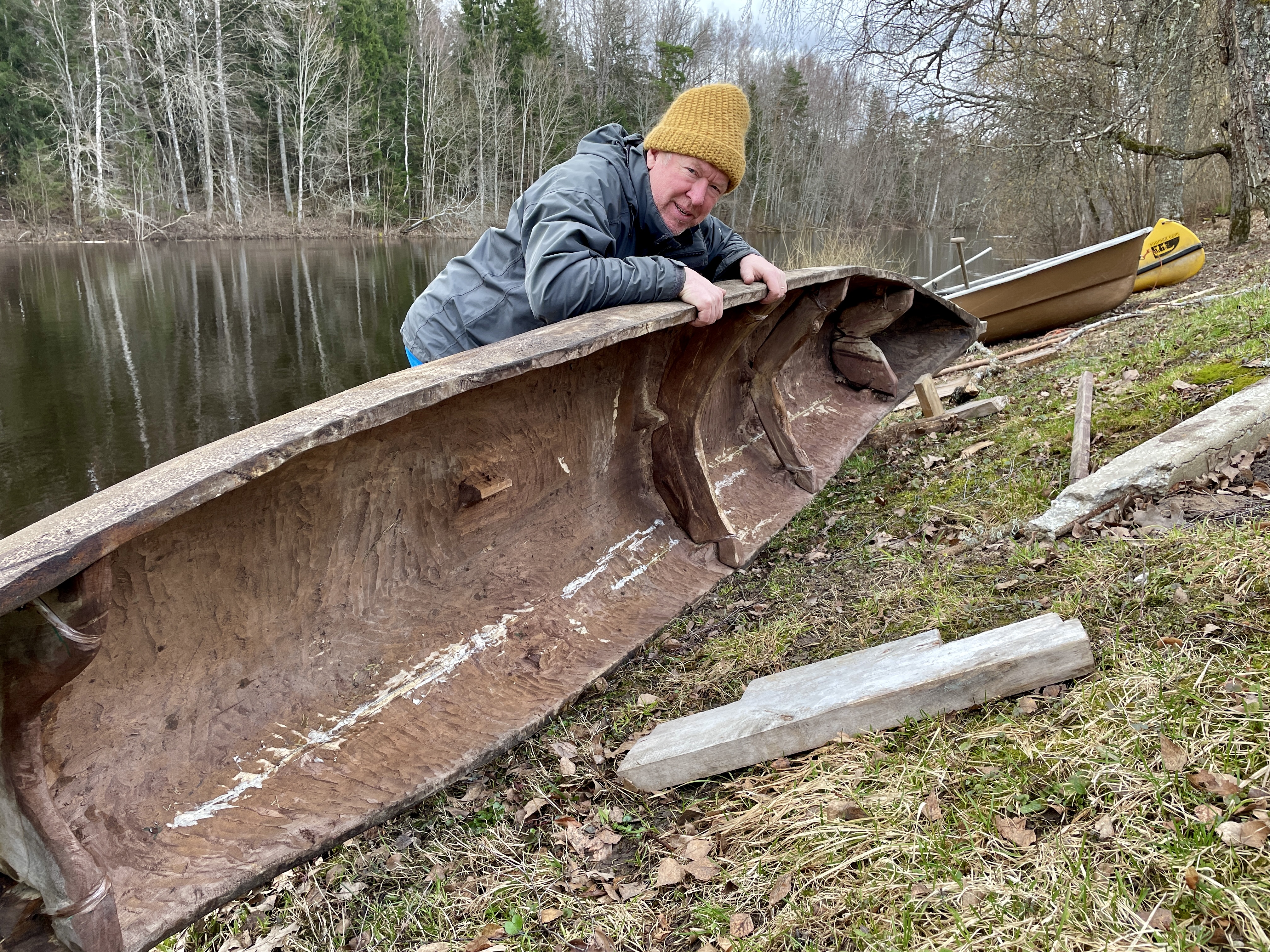 Aivar Rukkel and a traditional wooden dugout canoe