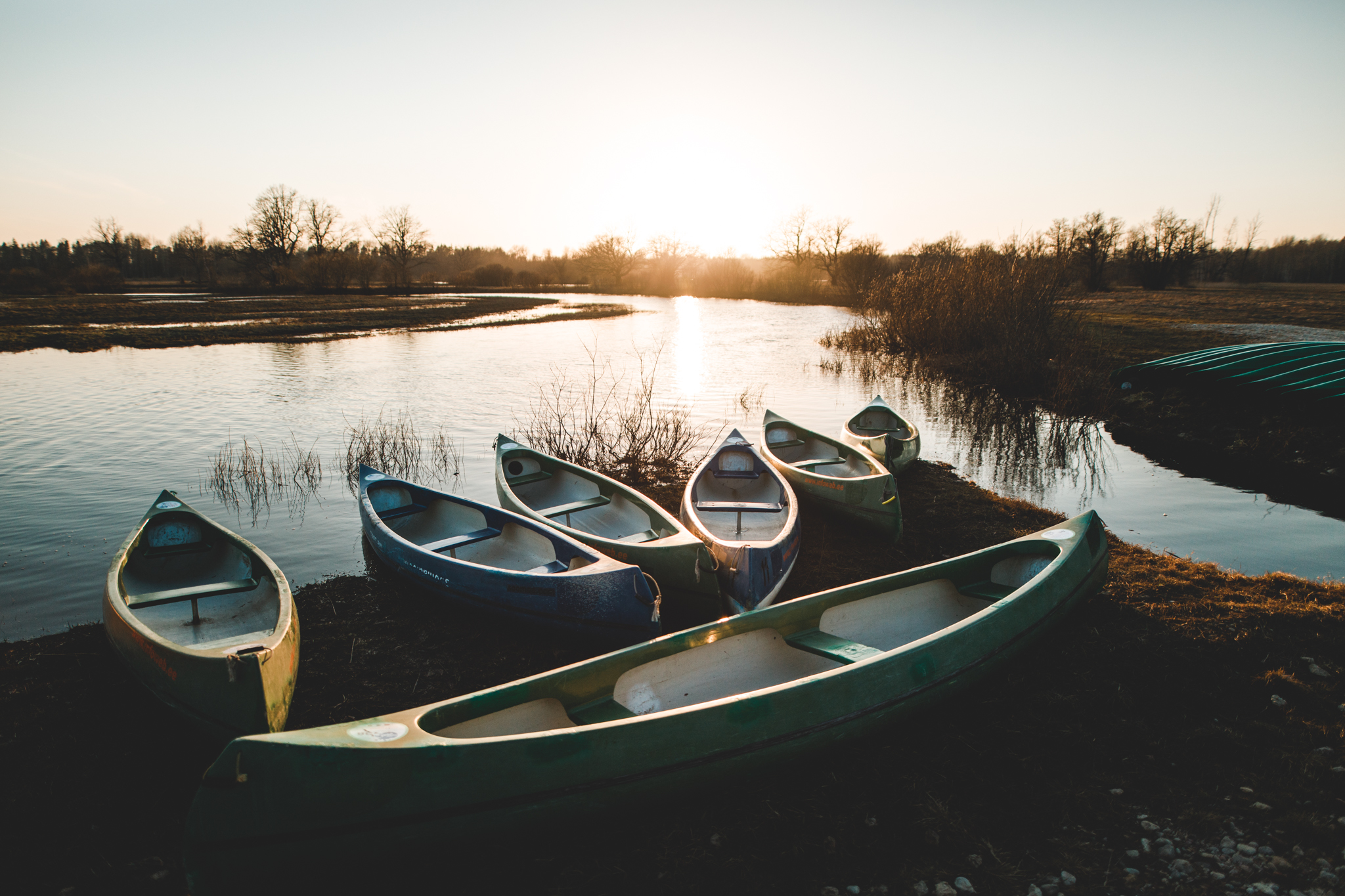 Canoes lined up at sunset in Soomaa National Park in Estonia