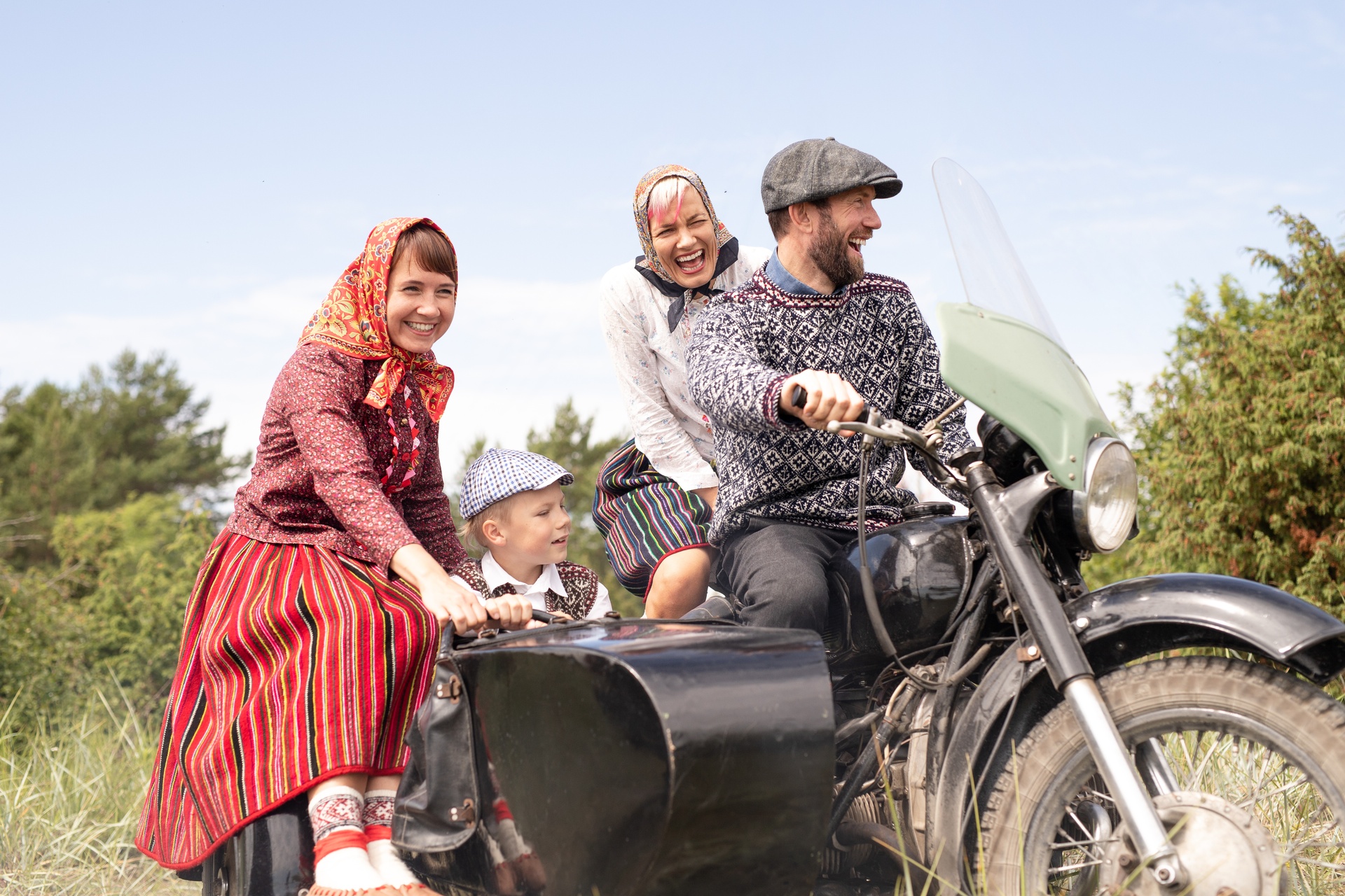 Kihnu family riding with motorbike