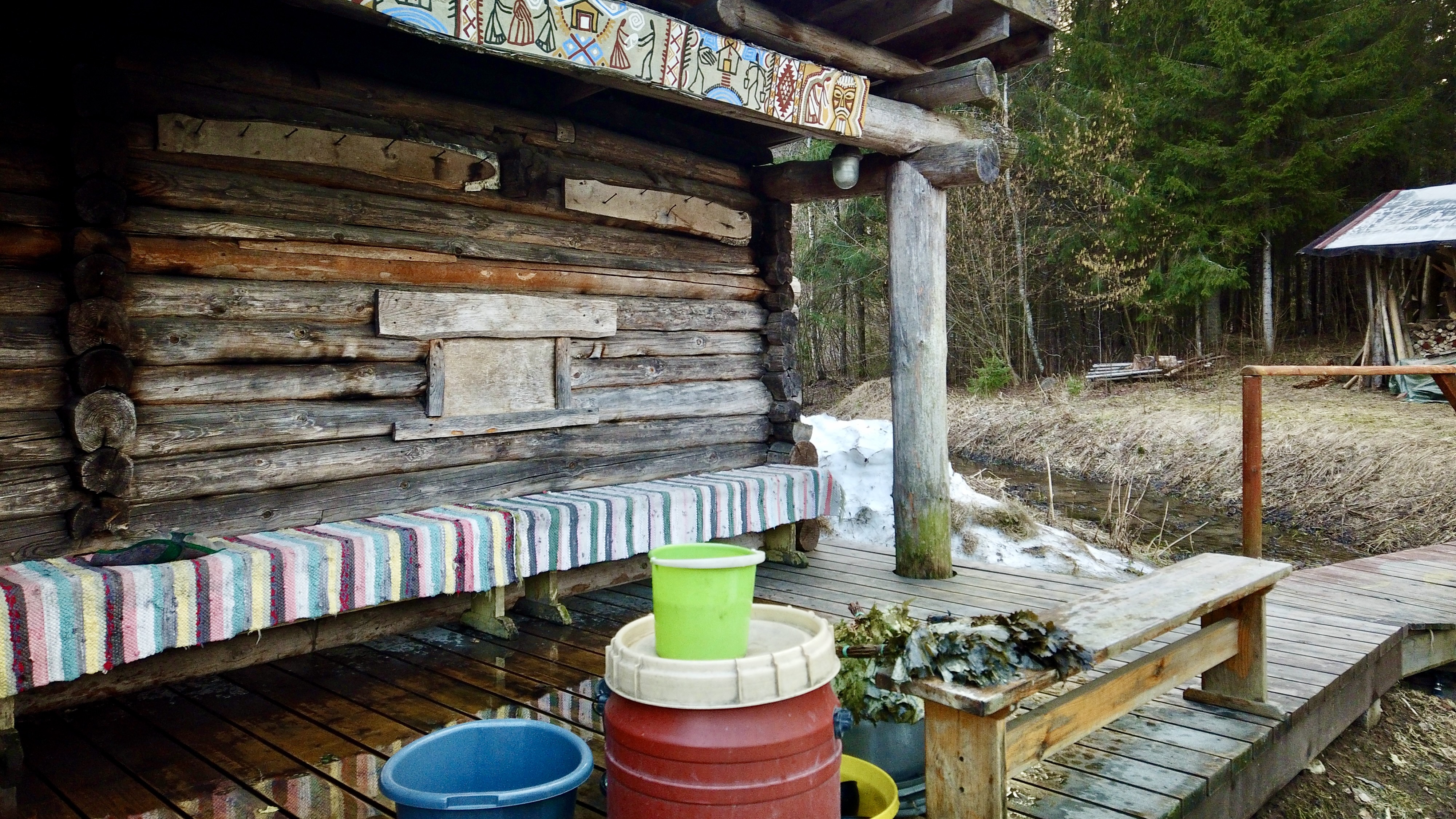 Viht and water buckets outside Mooska smoke sauna in Estonia