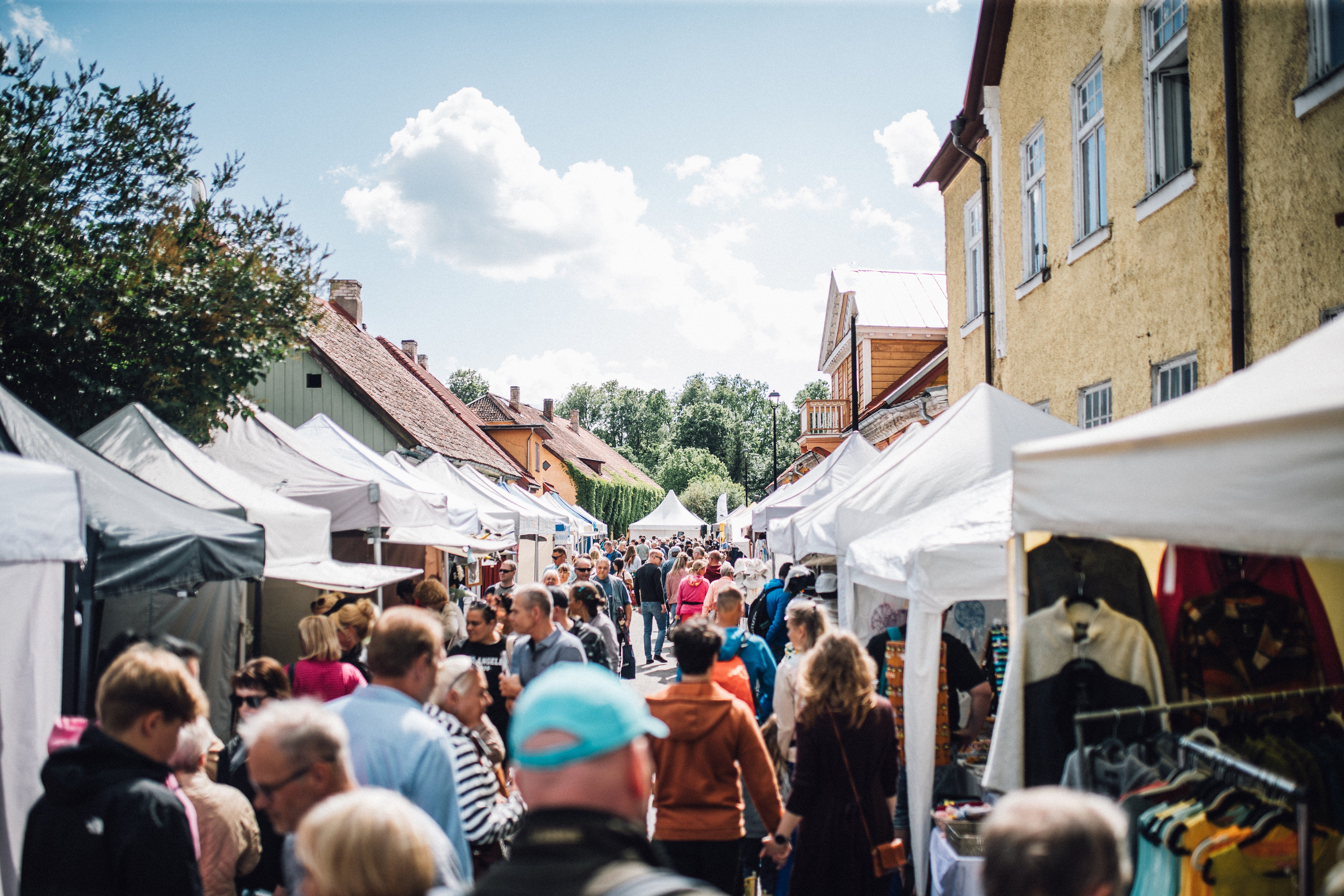 White tents and busy summer street fair in Viljandi