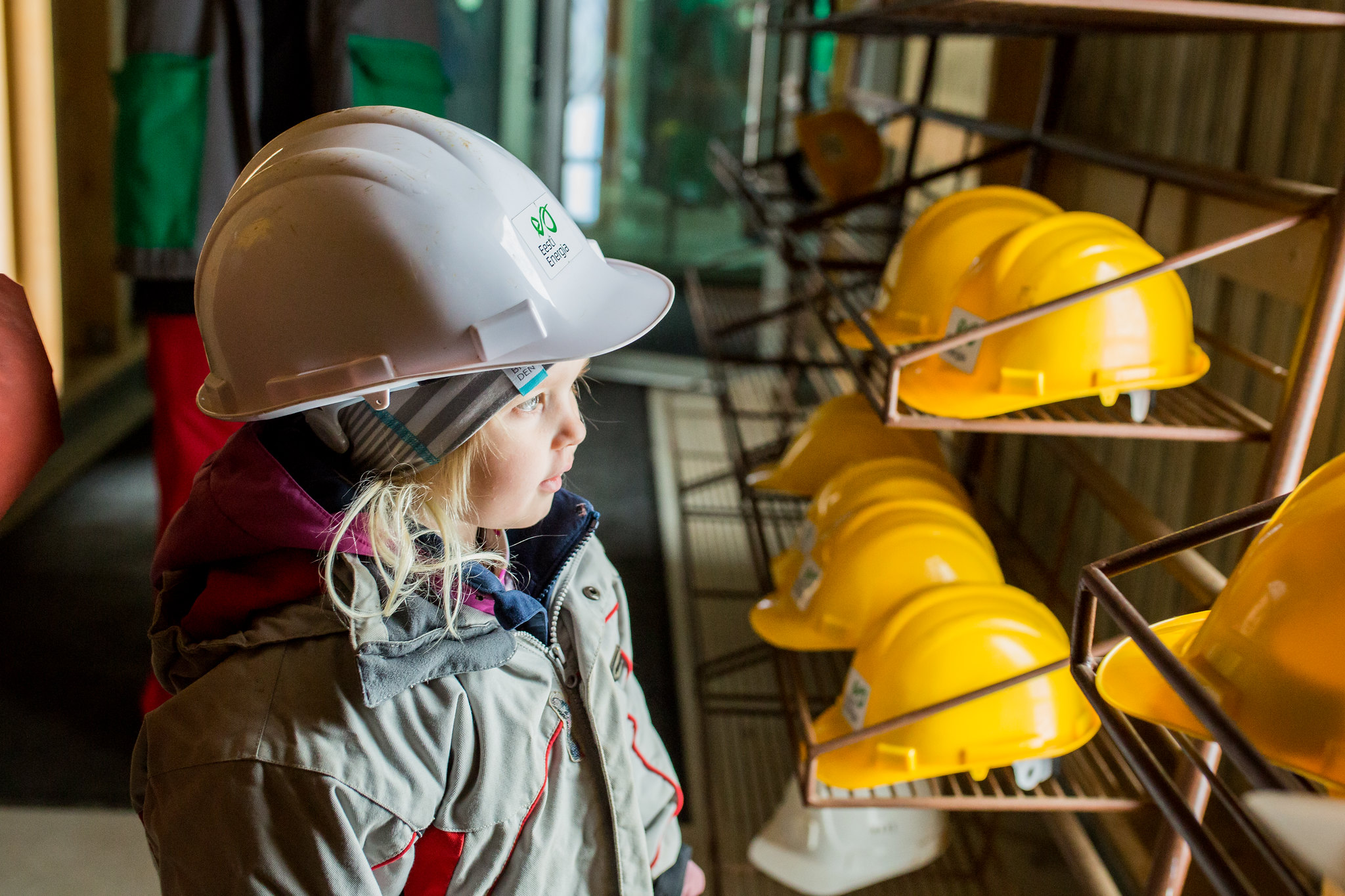 Little girl wearing construction helmet at Mining Museum