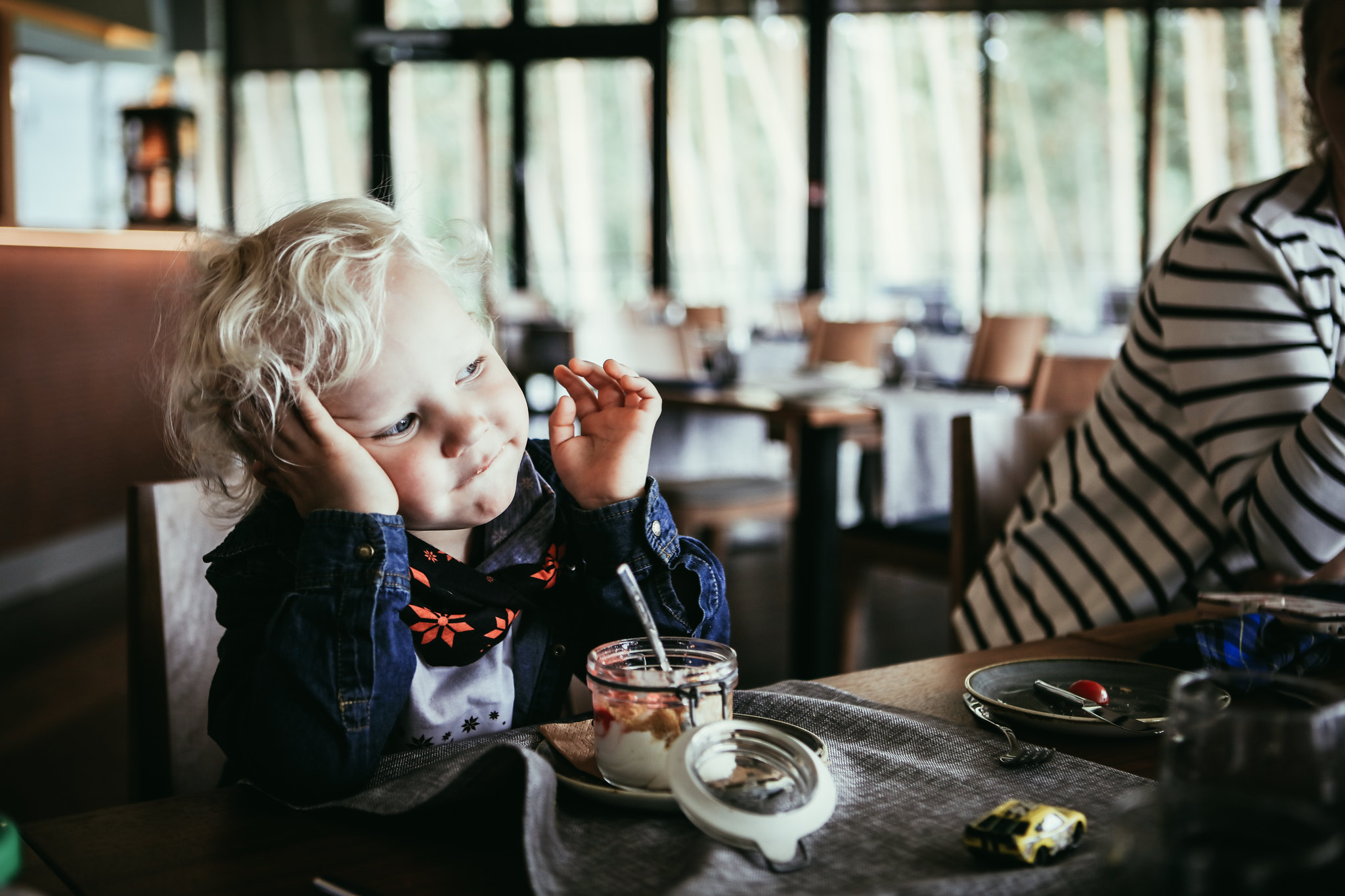 Little boy eating dessert at a restaurant in Estonia