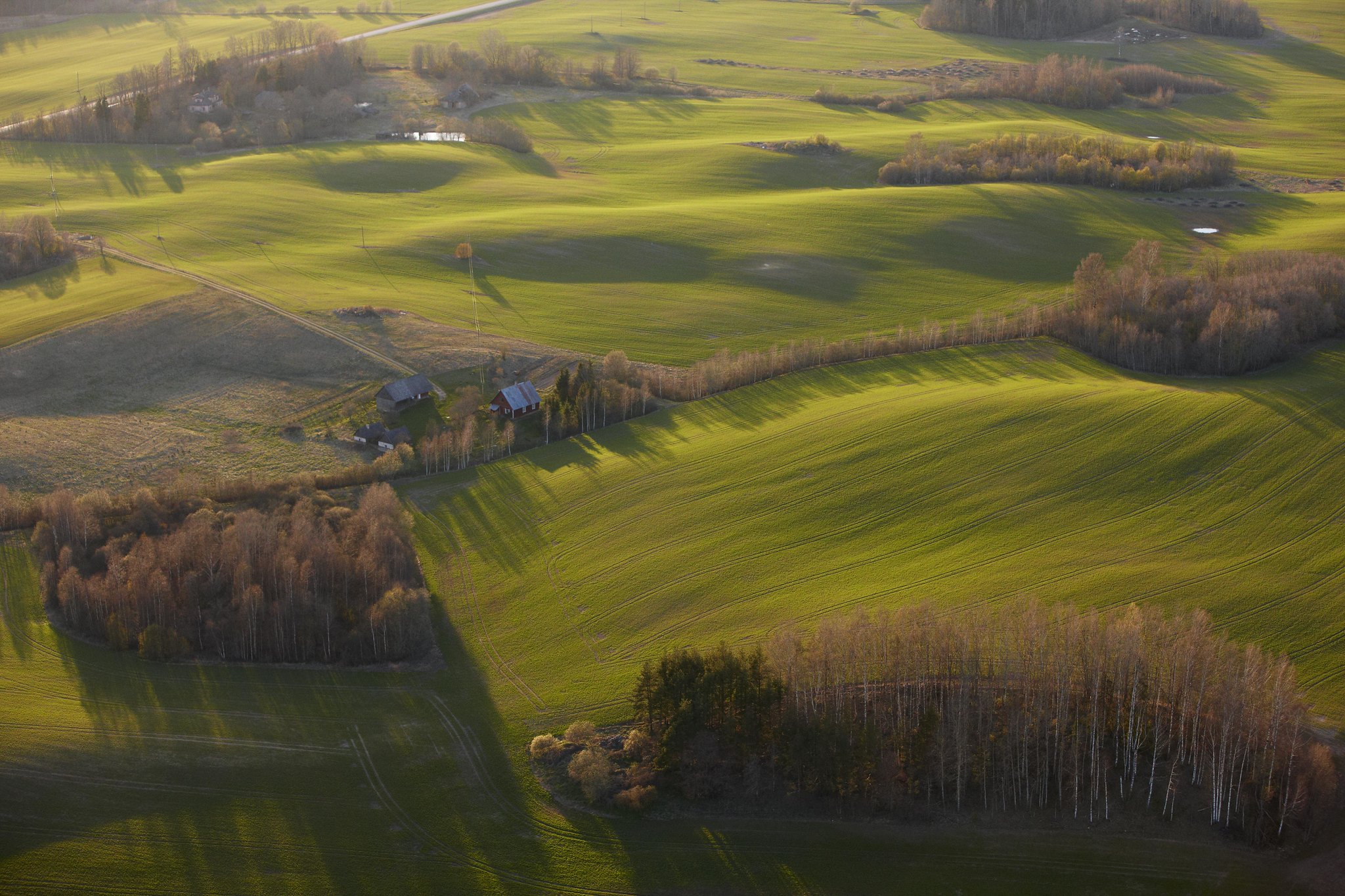 Arial view of Old Võromaa hilly countryside and farms