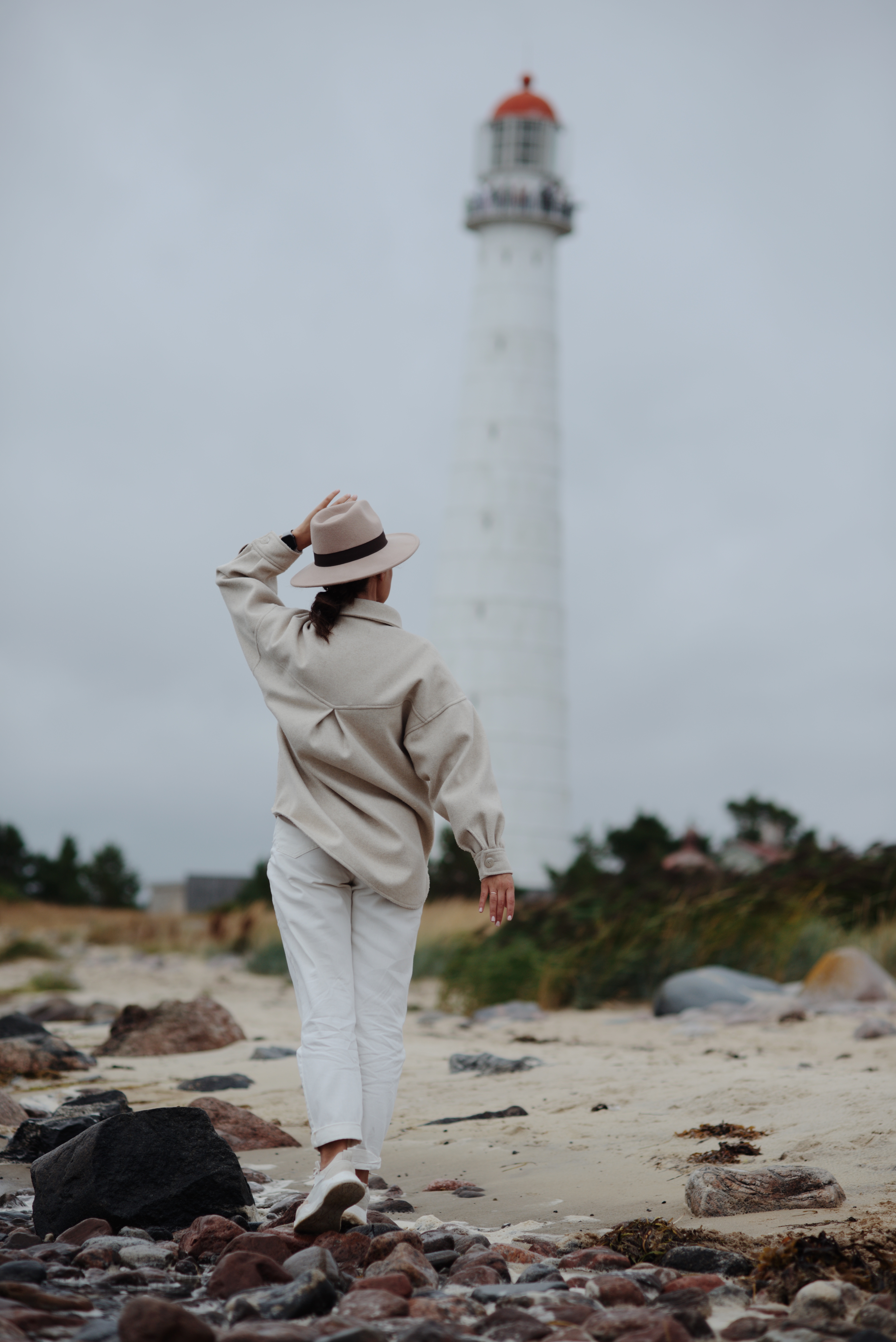 Woman walking near Tahkuna lighthouse on Hiiumaa