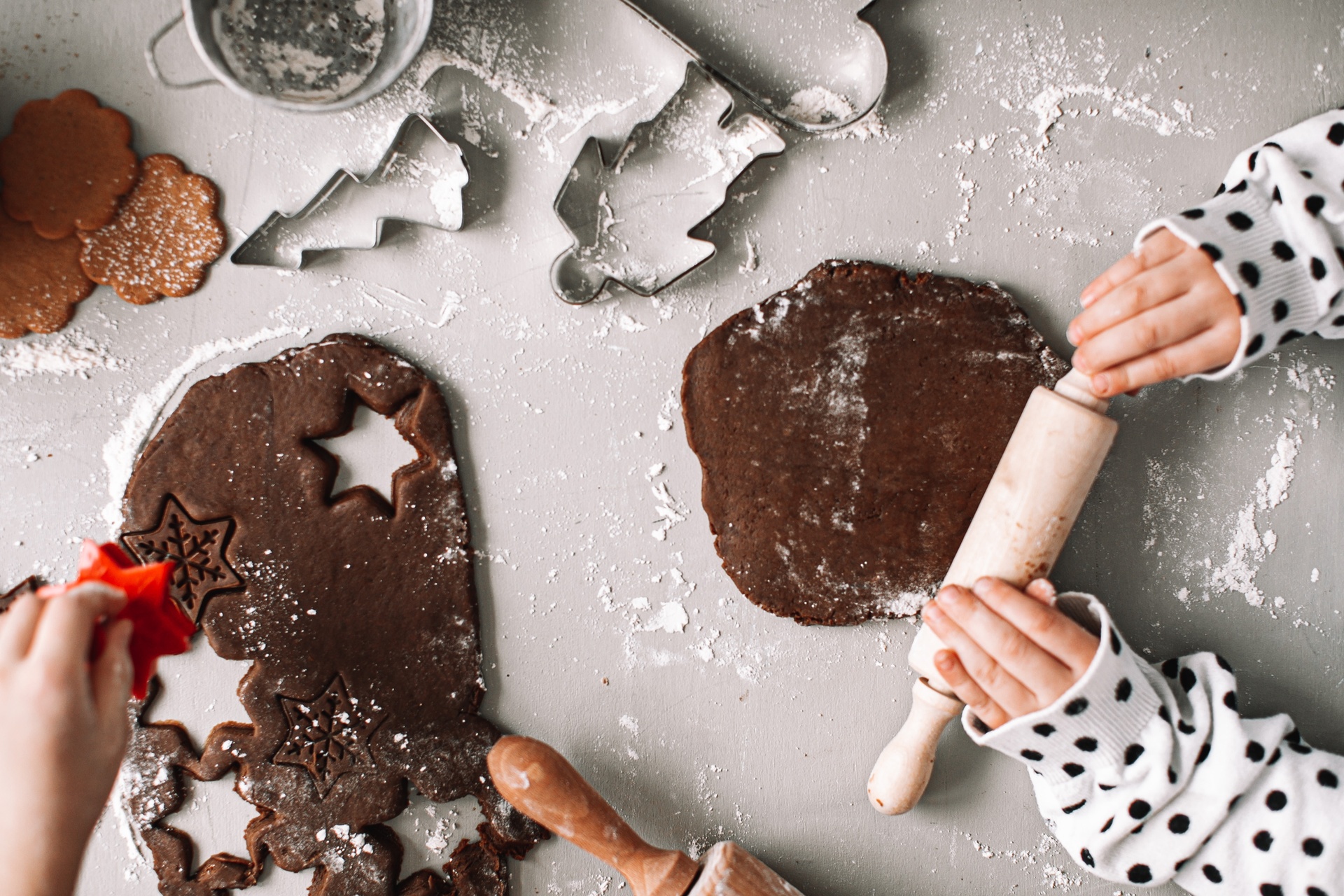 Rolling out gingerbread and making cookies