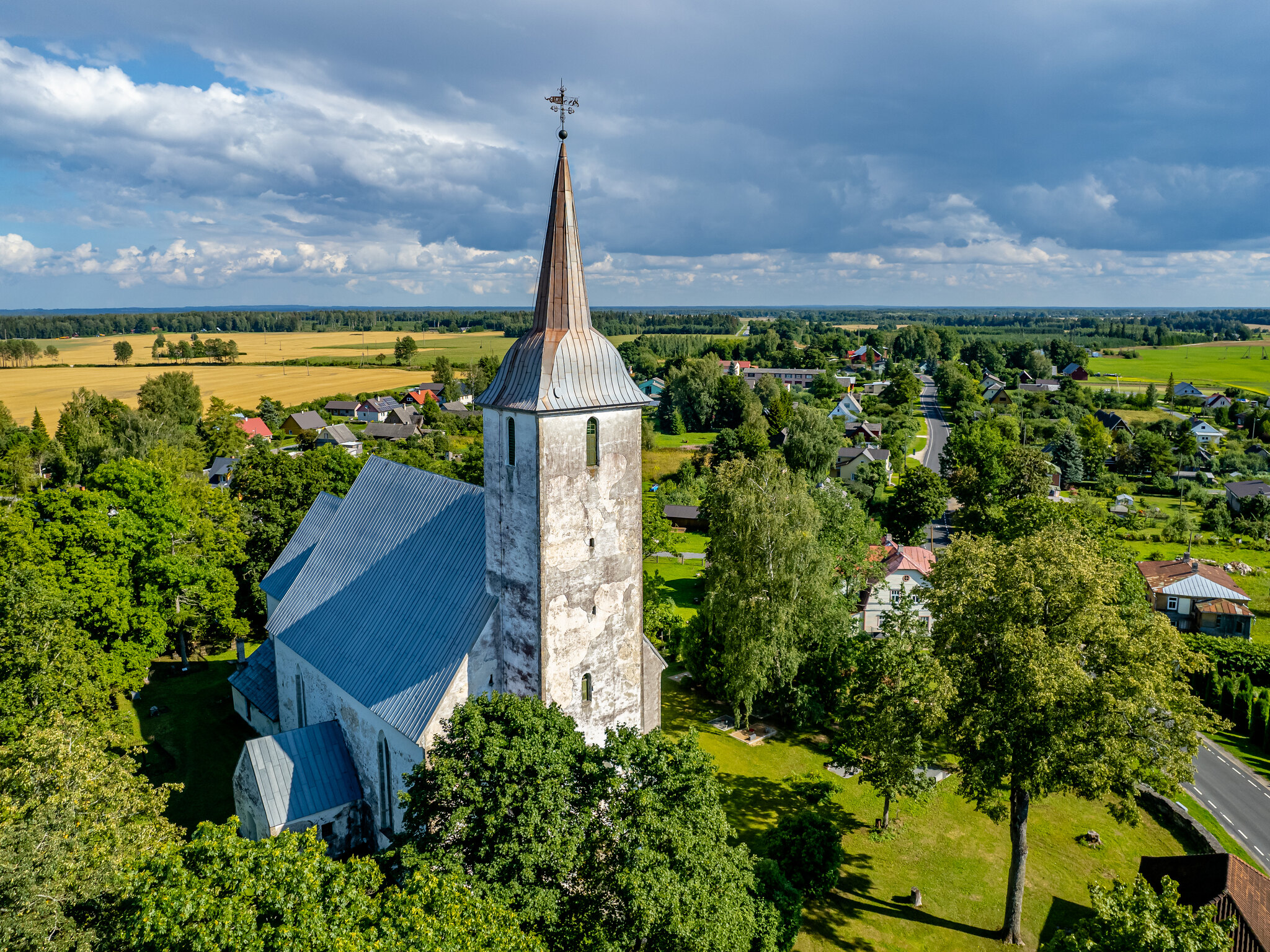 Koeru church in Järva County, Estonia, grey clouds, greenery