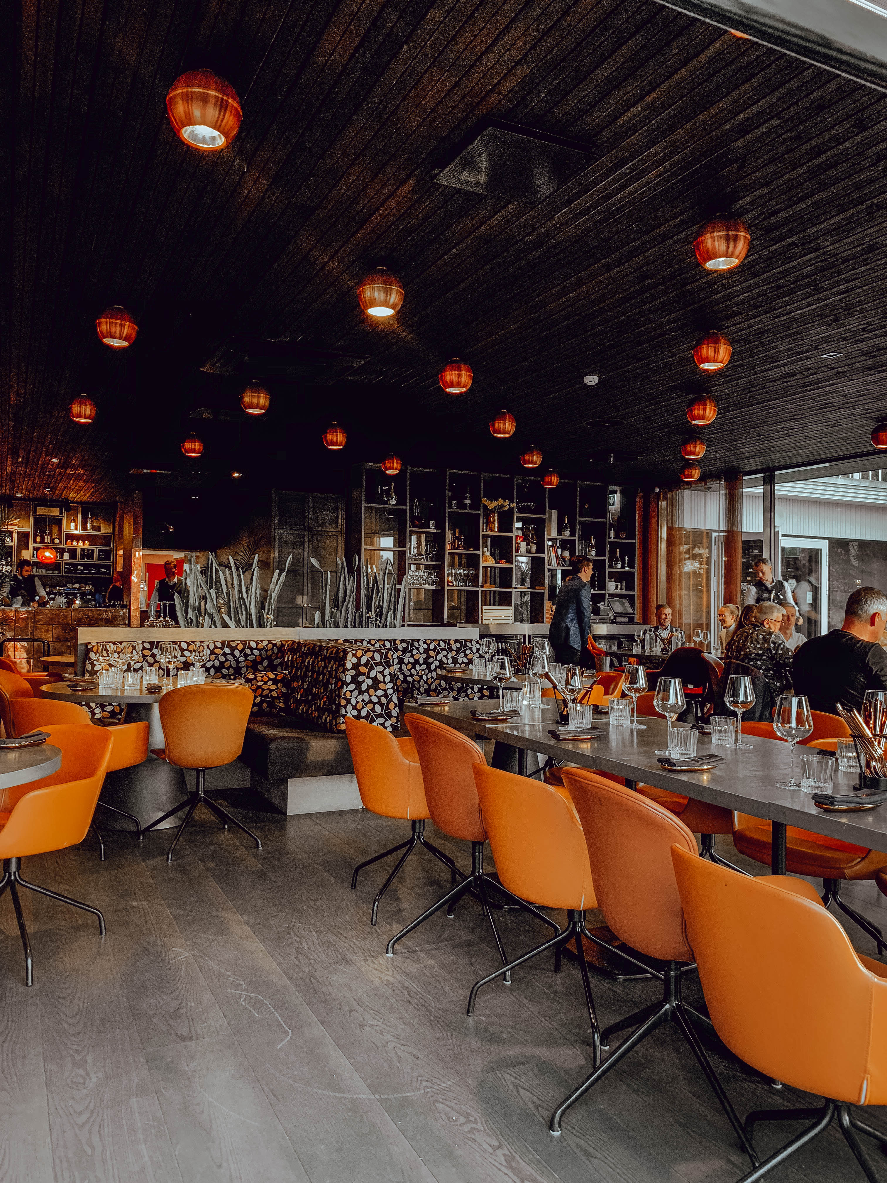 Orange chairs and retro vibes at Tuljak in Tallinn