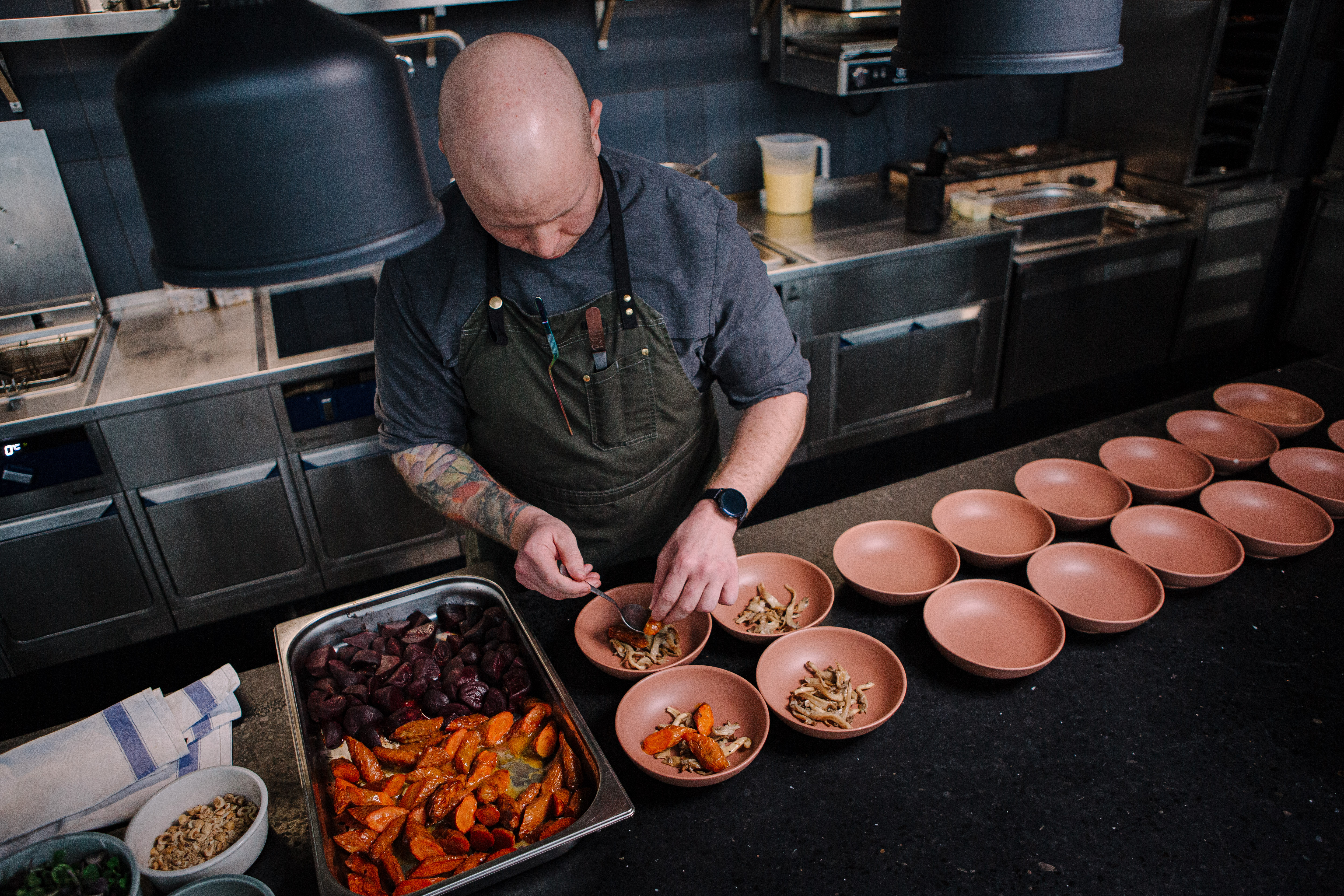 Chef plates food for a zero-waste dinner