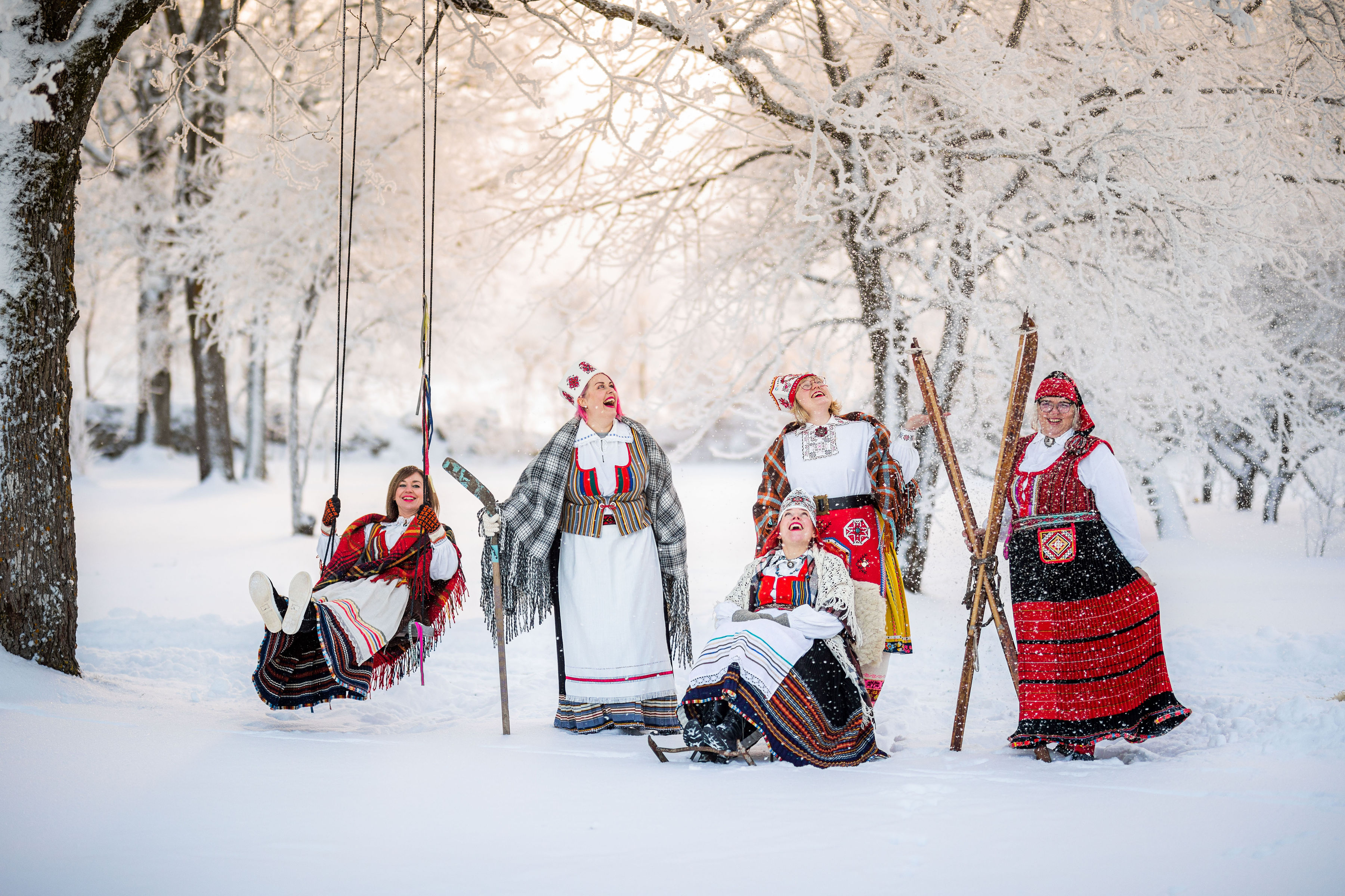 Women in traditional costumes from Muhu and Saaremaa in snow