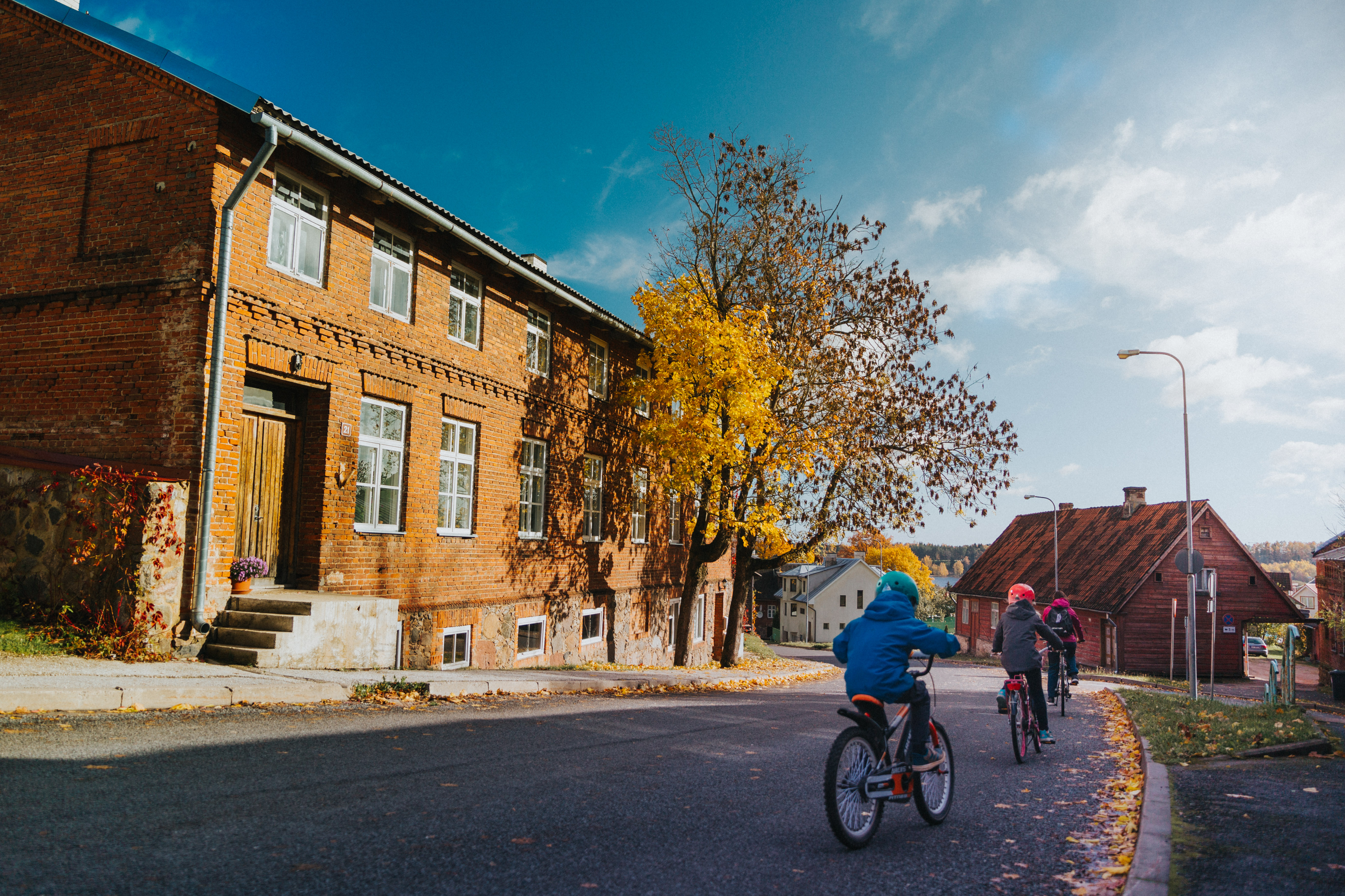 Kids riding bikes during autumn in Viljandi