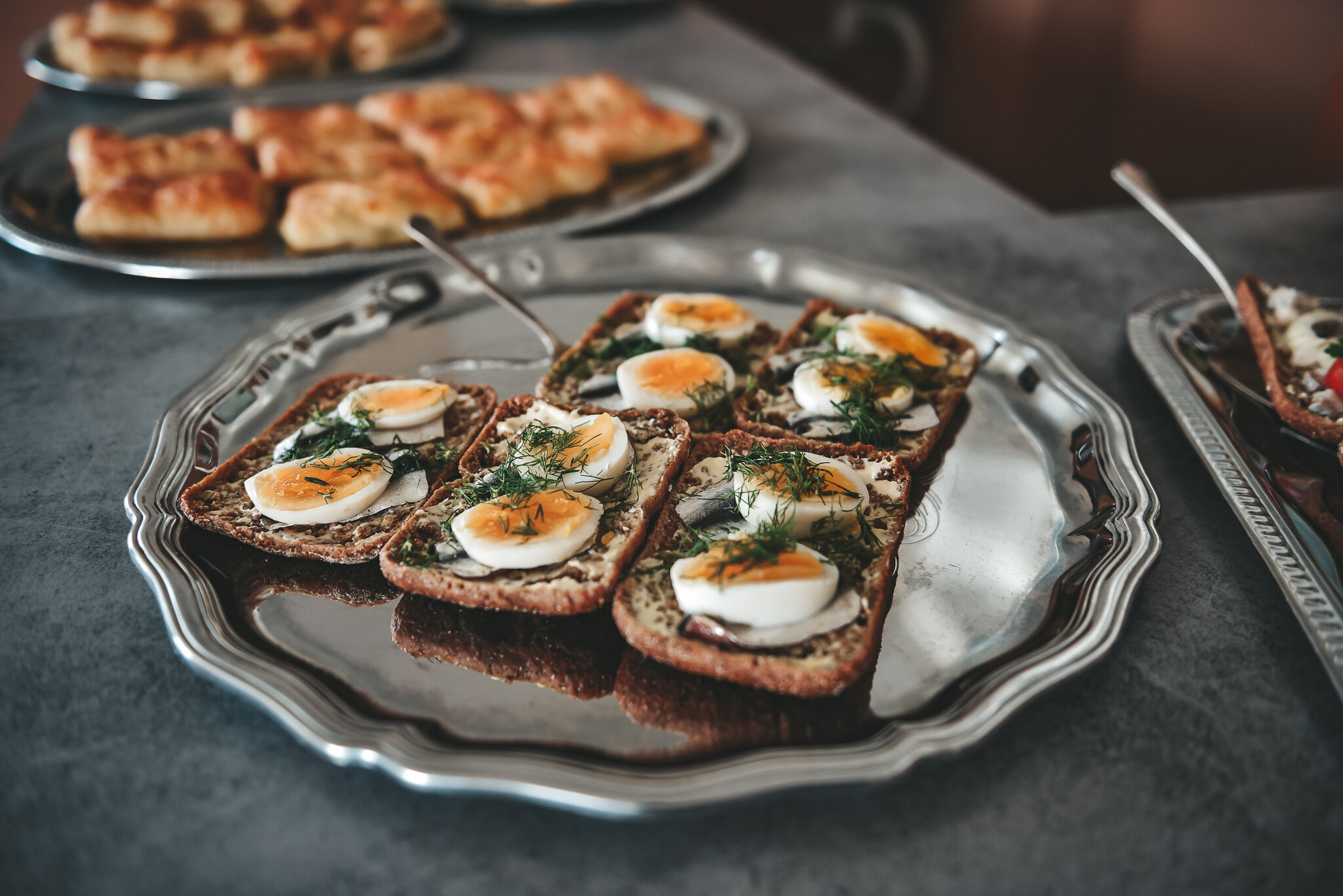 sprats with boiled egg and dill on rye bread, kiluvõileib