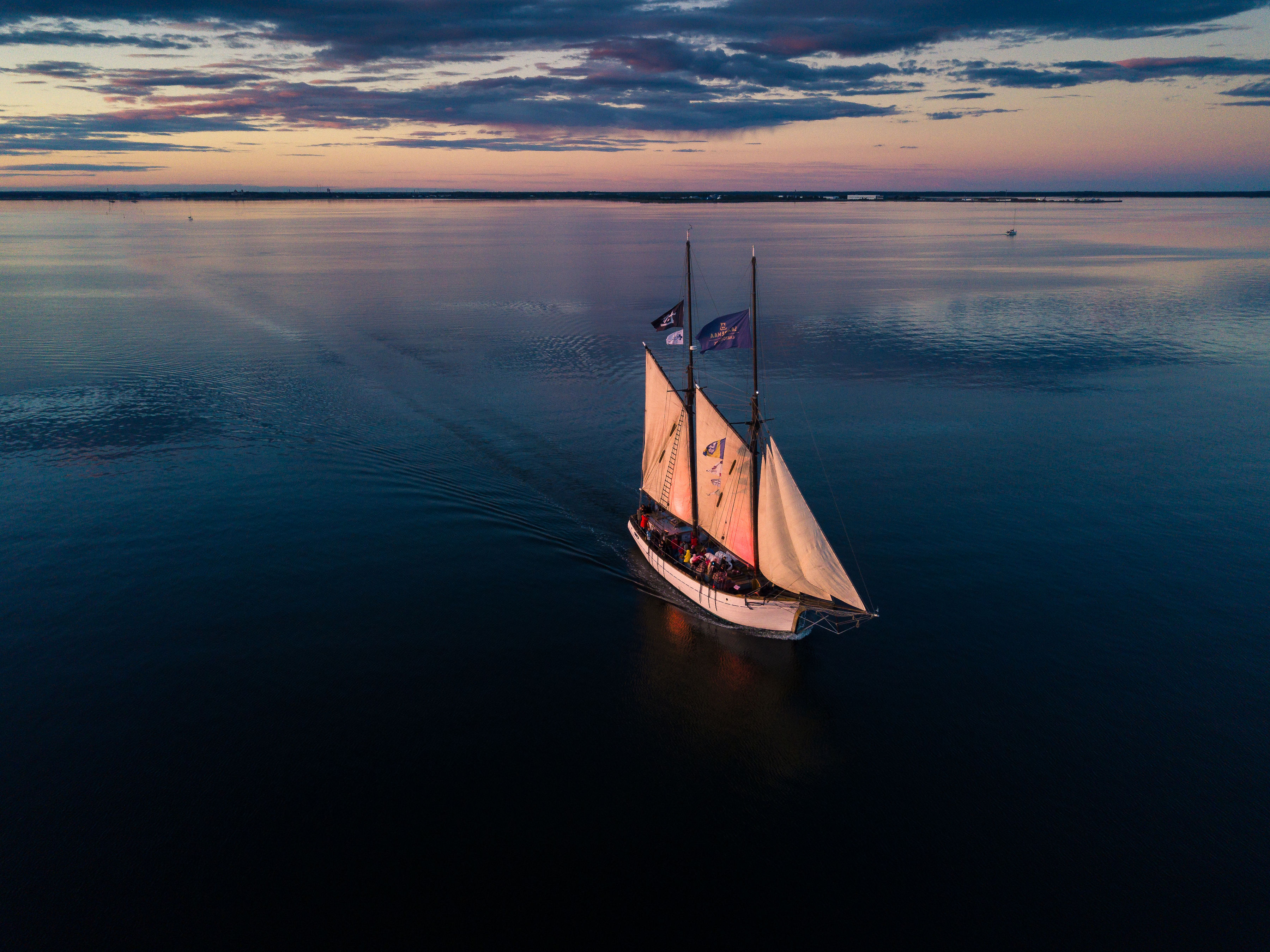 Historical sailboat the Hoppet at sunset near Saaremaa