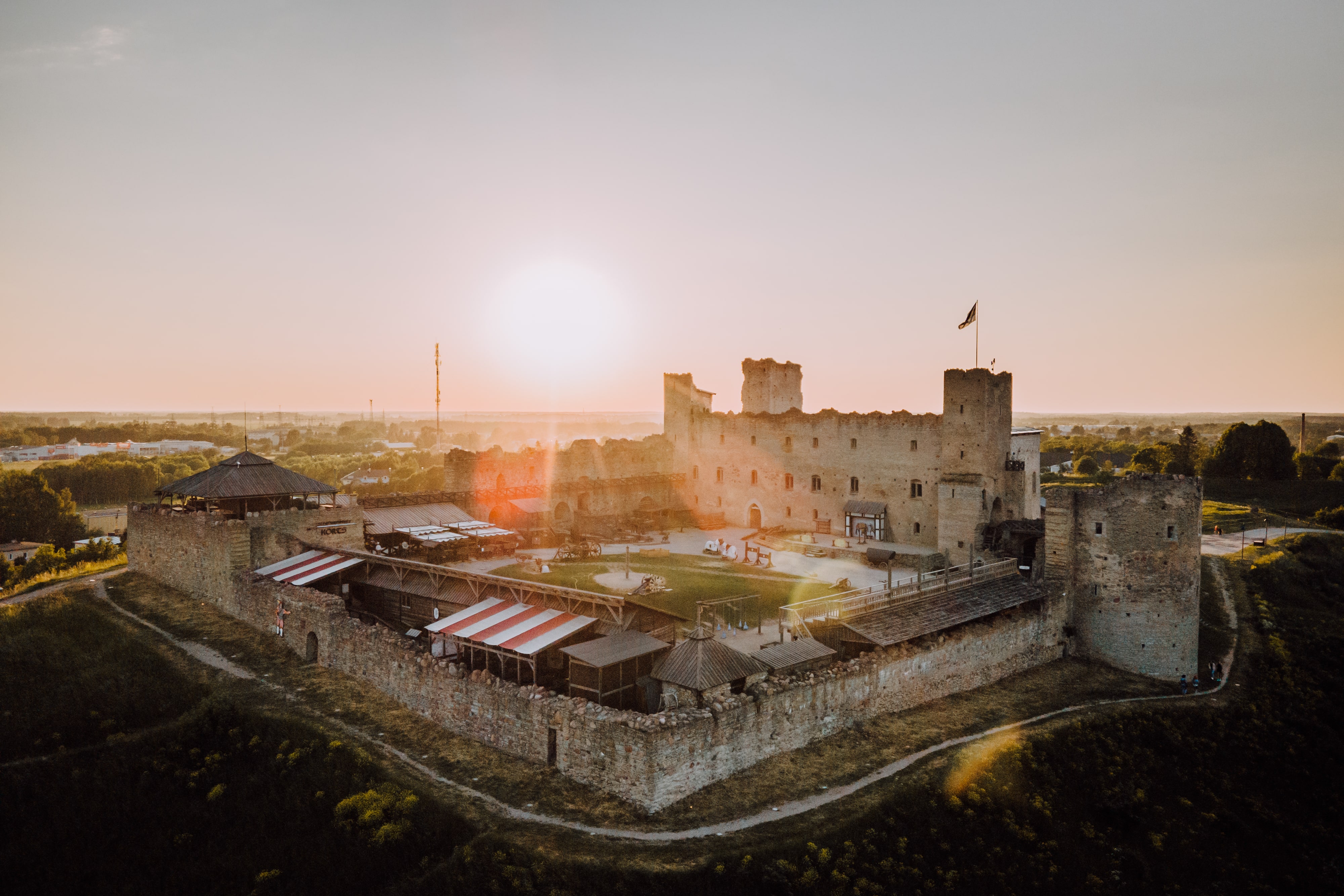 Rakvere Castle with sun low in the sky behind