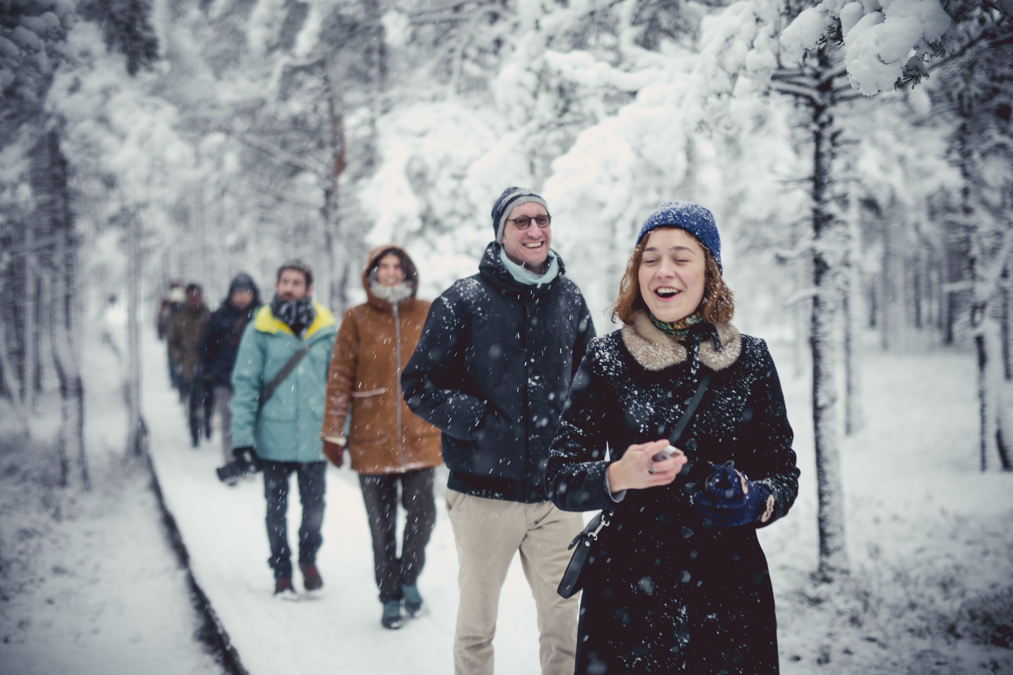 Group hiking in Viru bog in the snow