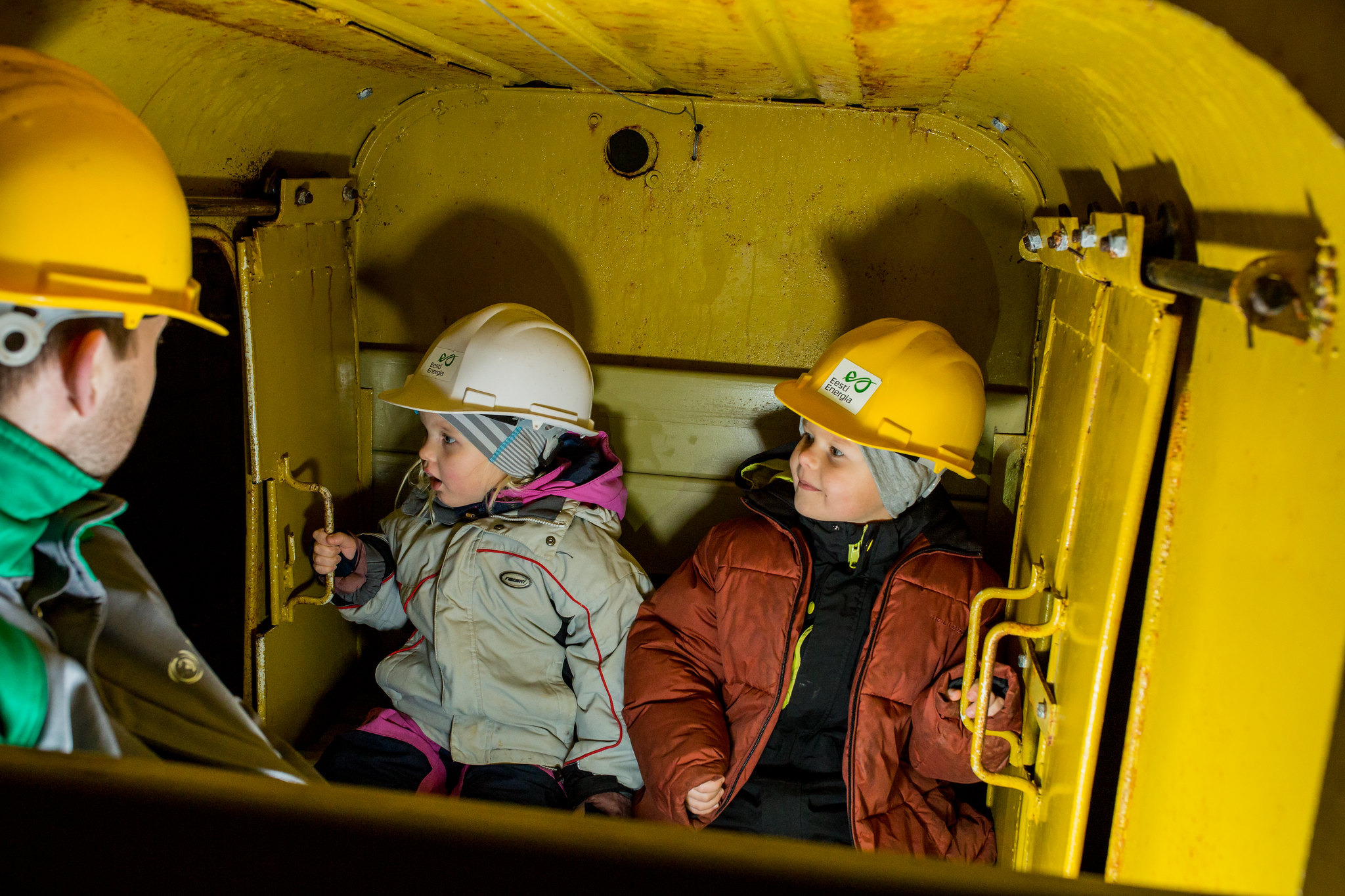 Children with hard hats at the Estonian Mining Museum