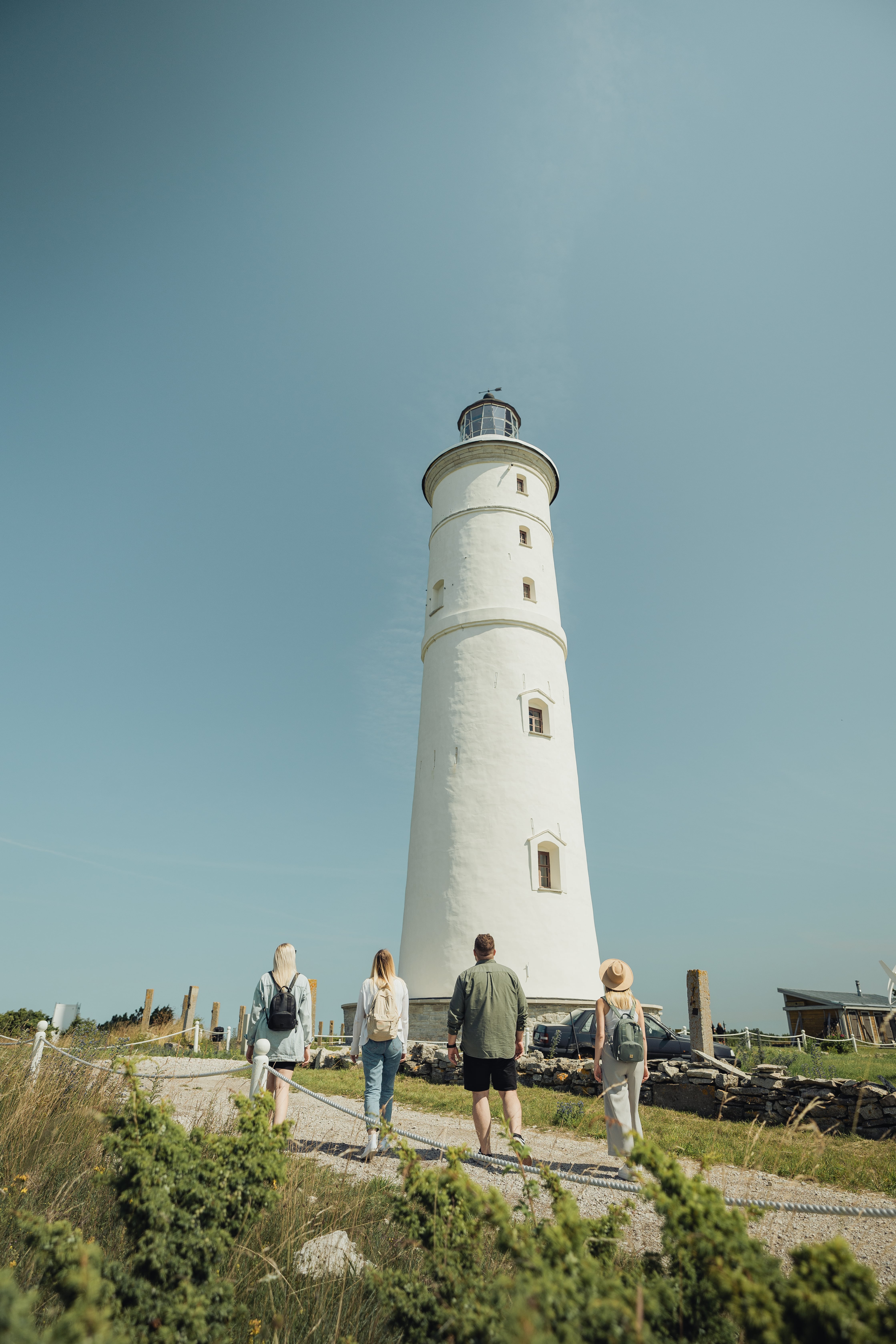 Group of people walk near Vilsandi Lighthouse