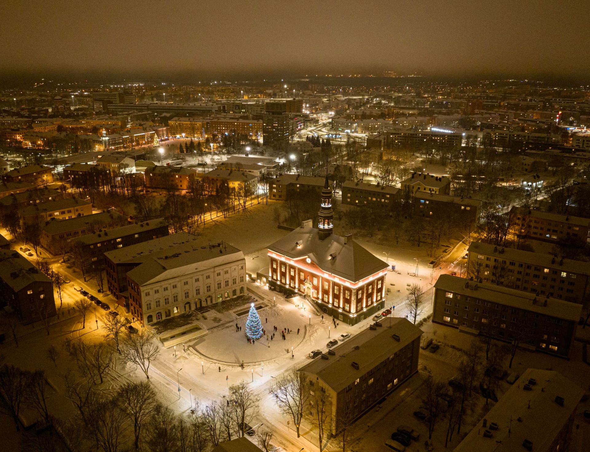 View of Narva Town Hall Square at night with Christmas tree