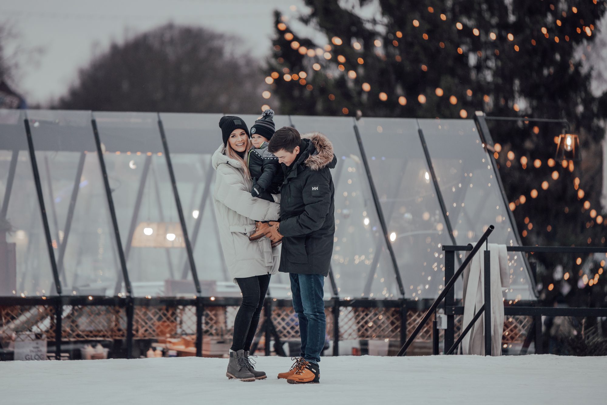 Wintery Tartu town hall square with family