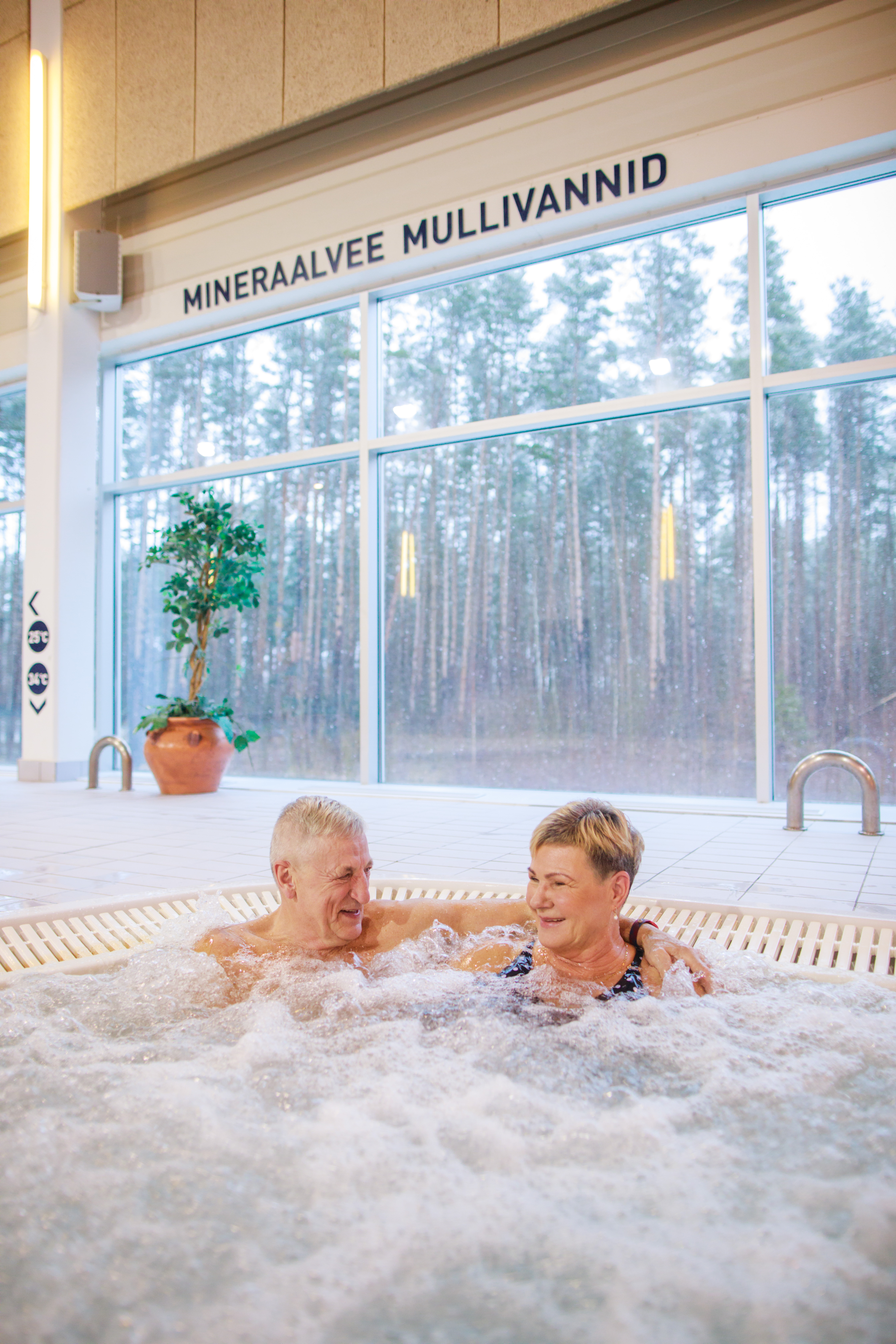 Couple in jacuzzi of Värska mineral water at spa in Estonia