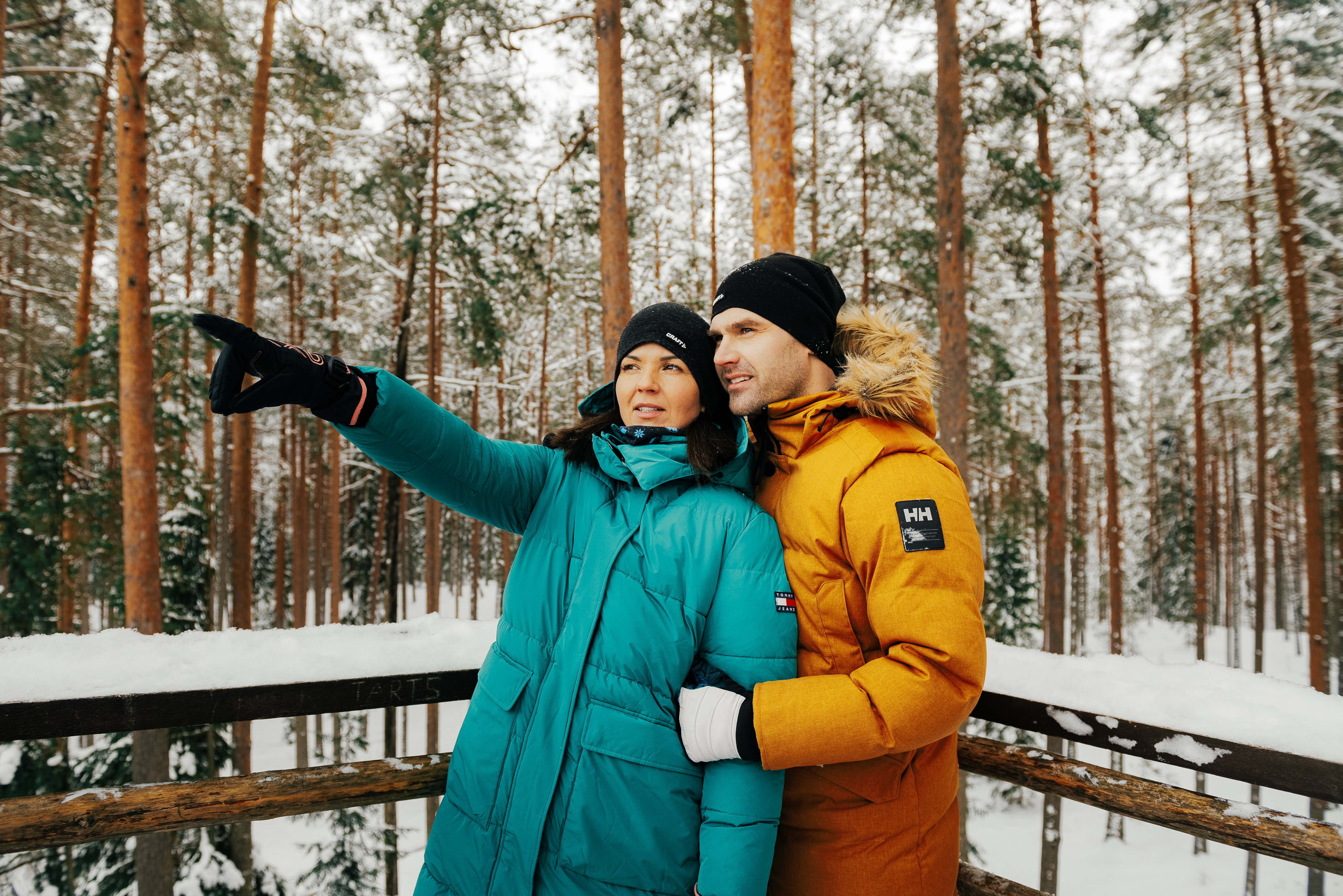 A couple in a winterly observing tower in Estonian nature