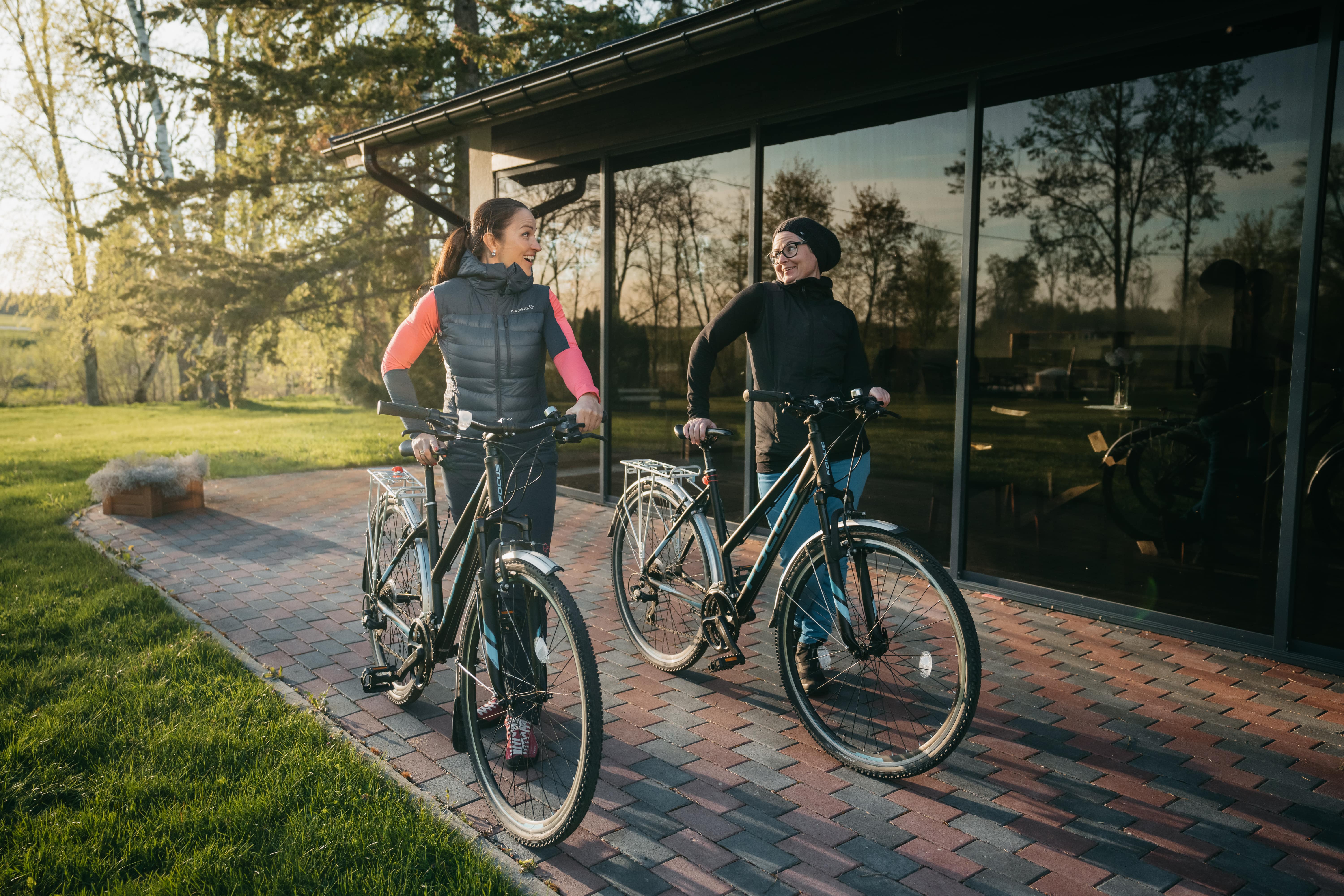 Two women with bicycles in Kõrvemaa, Estonia