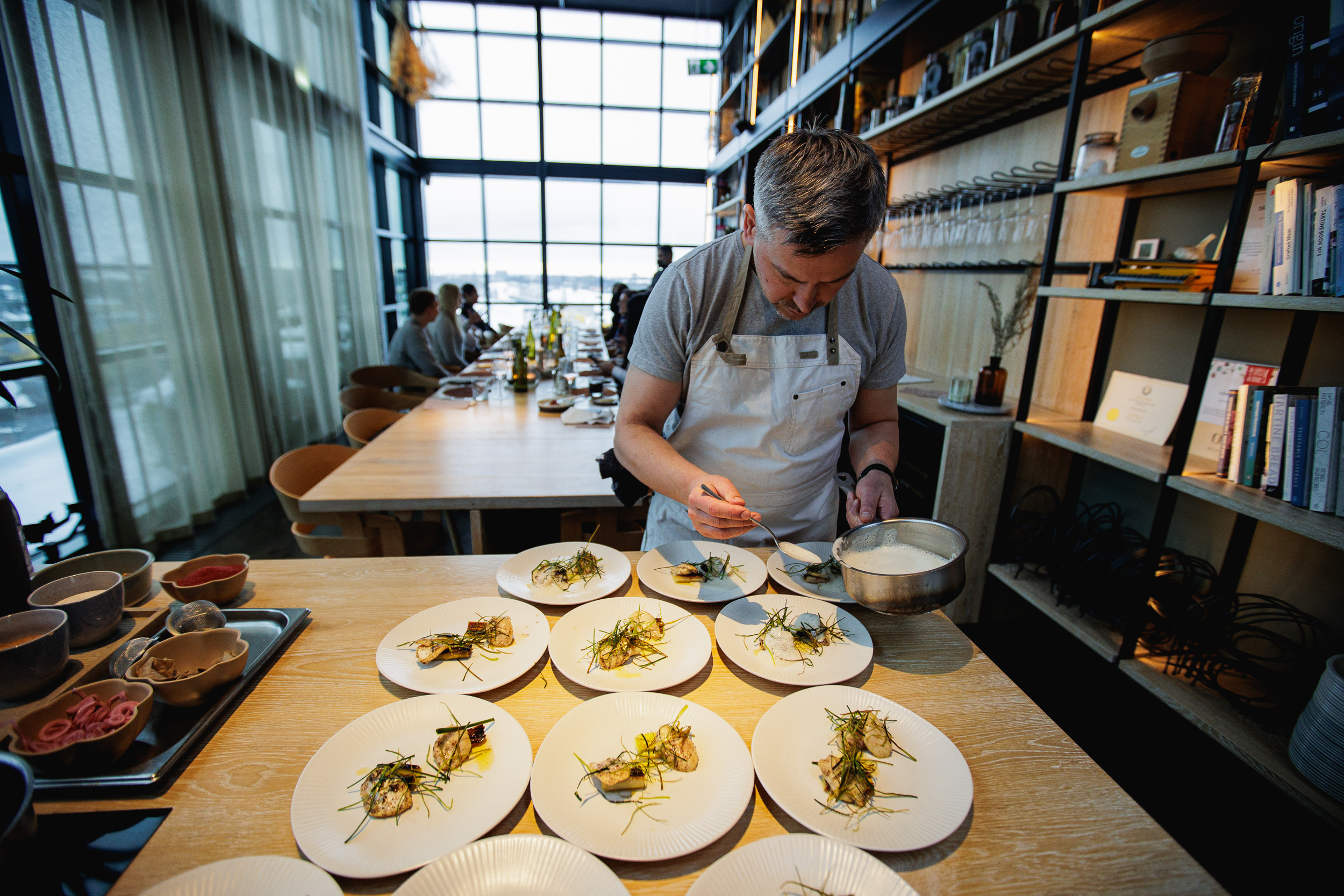 Chef at Fotografiska Tallinn plates food