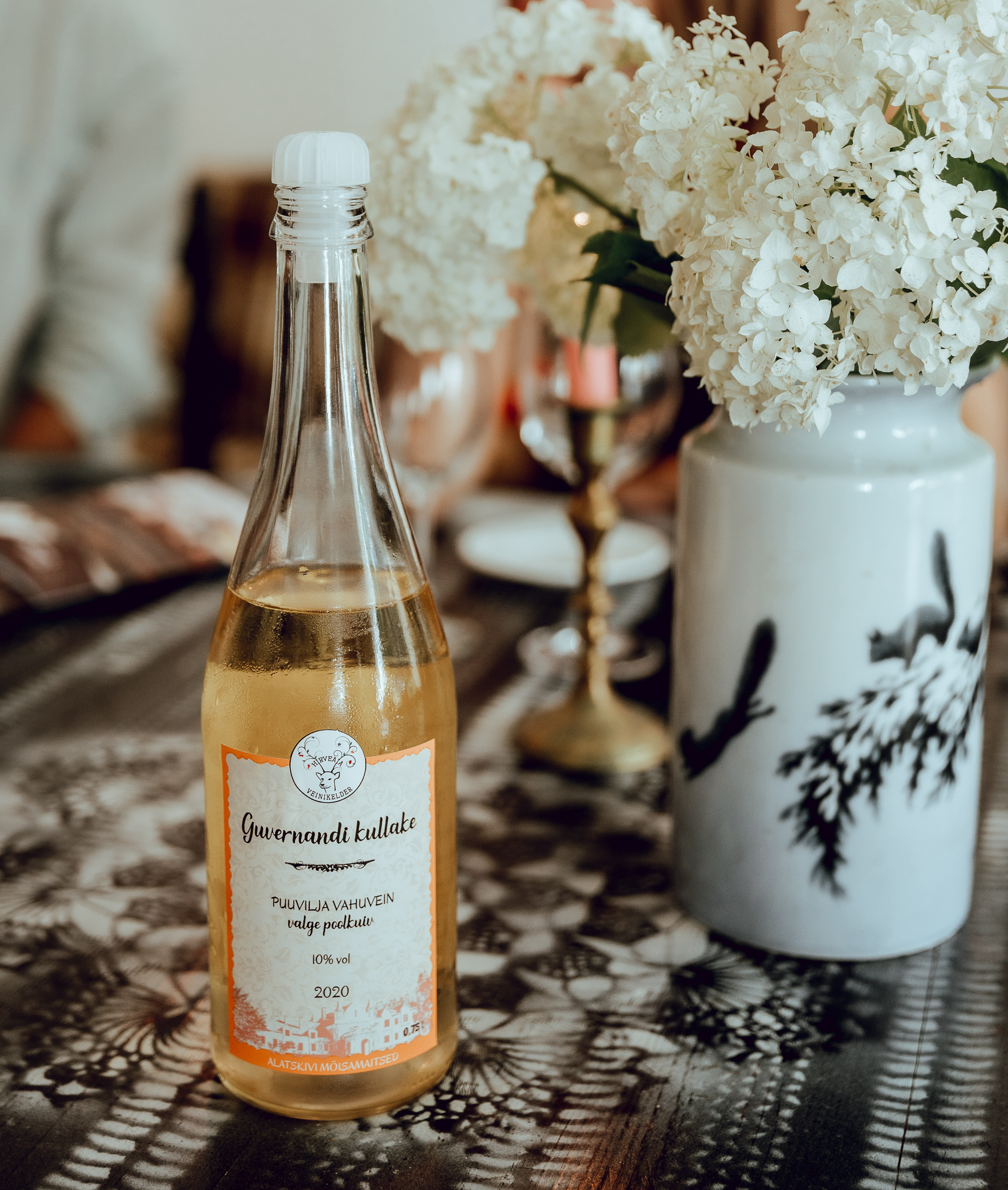 Estonian white wine on a table with flowers