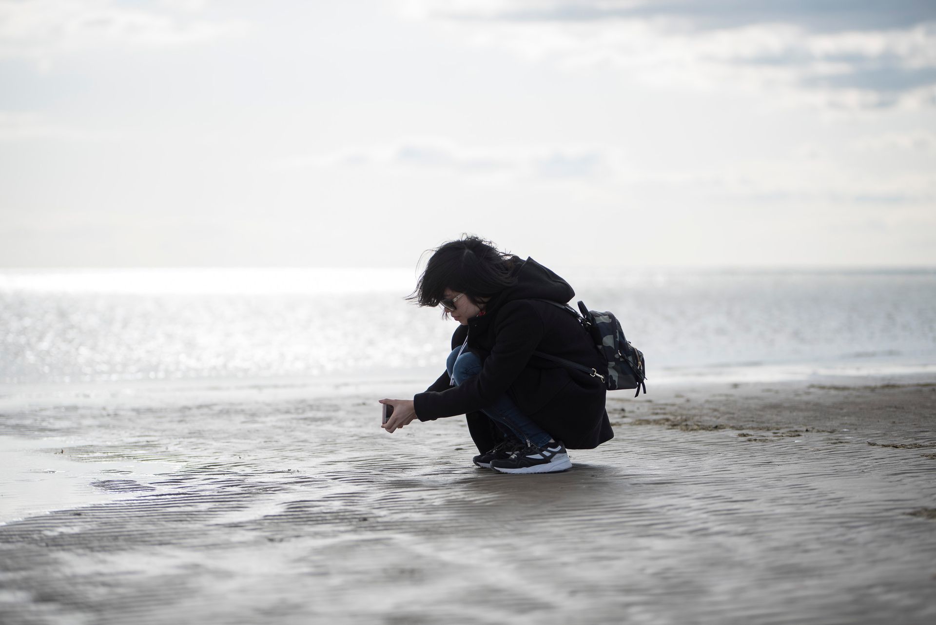 Woman on beach by sea