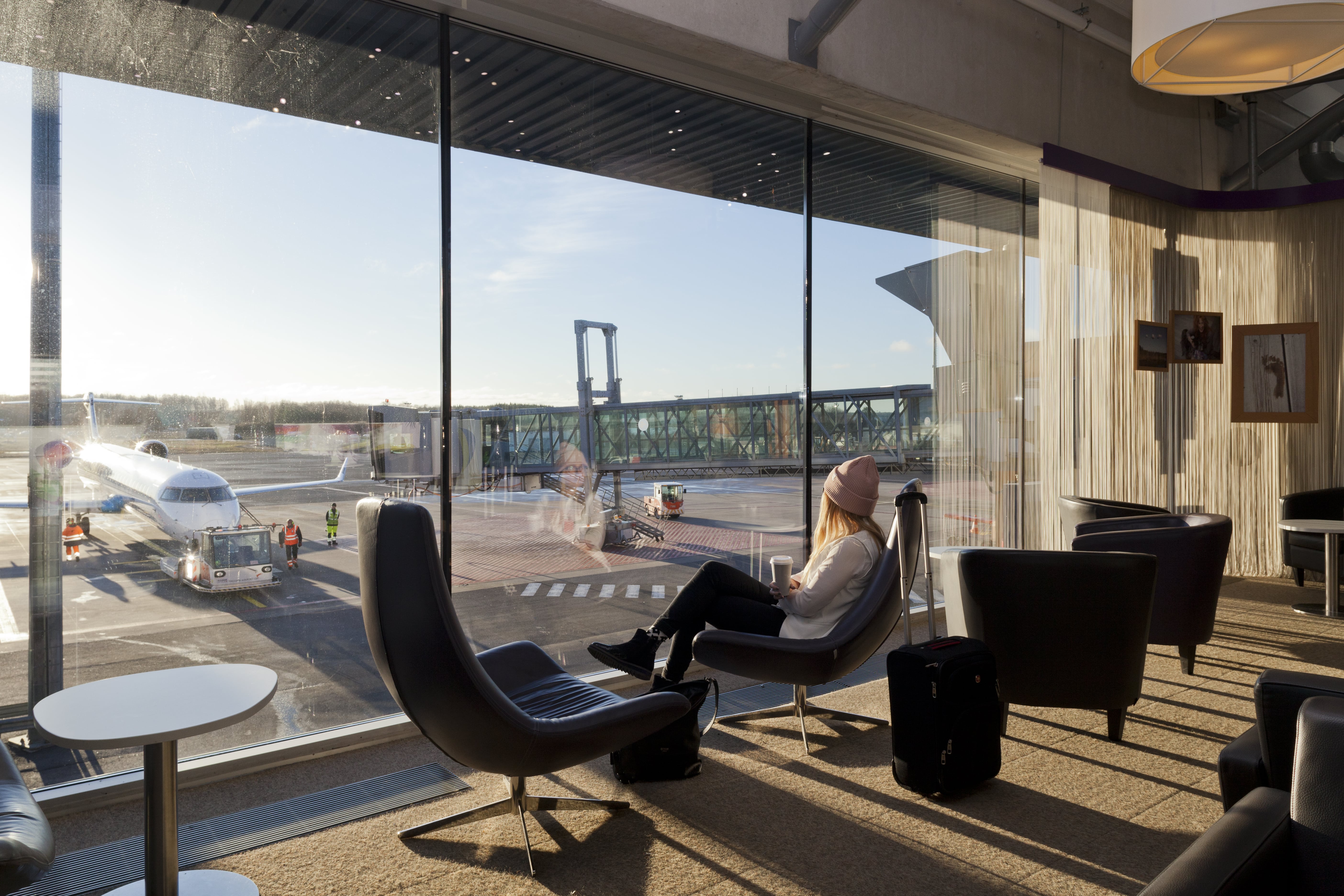 Woman waiting for flight at Tallinn Airport