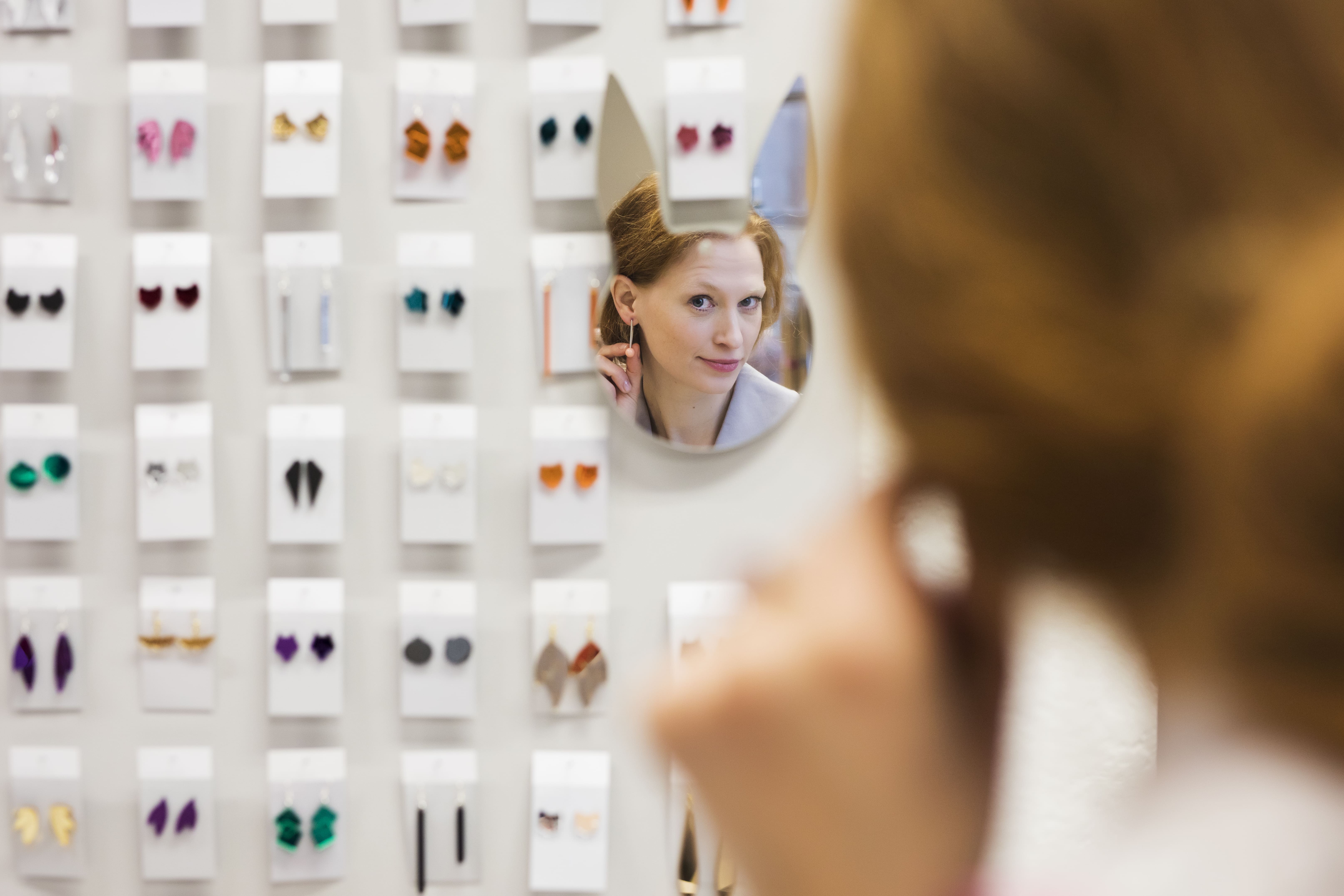 Woman shops for Estonian-designed jewelry in Tallinn