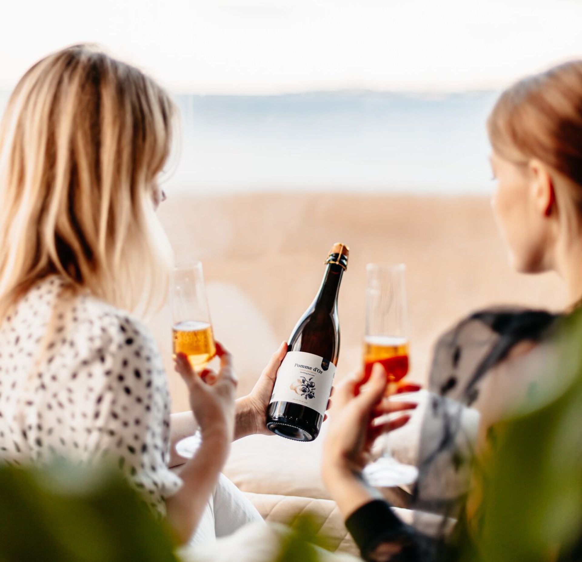 Women drink wine made in Estonia