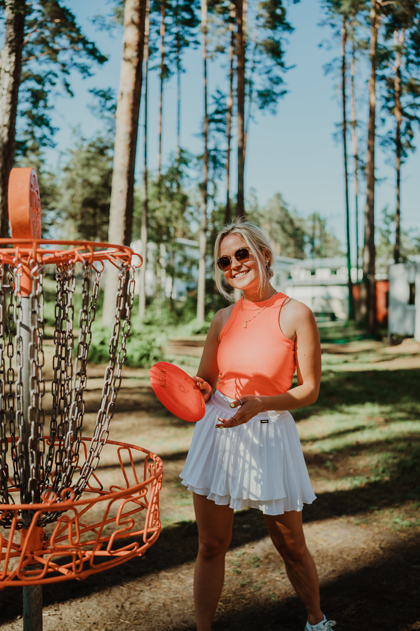 Woman plays disc golf in Estonia