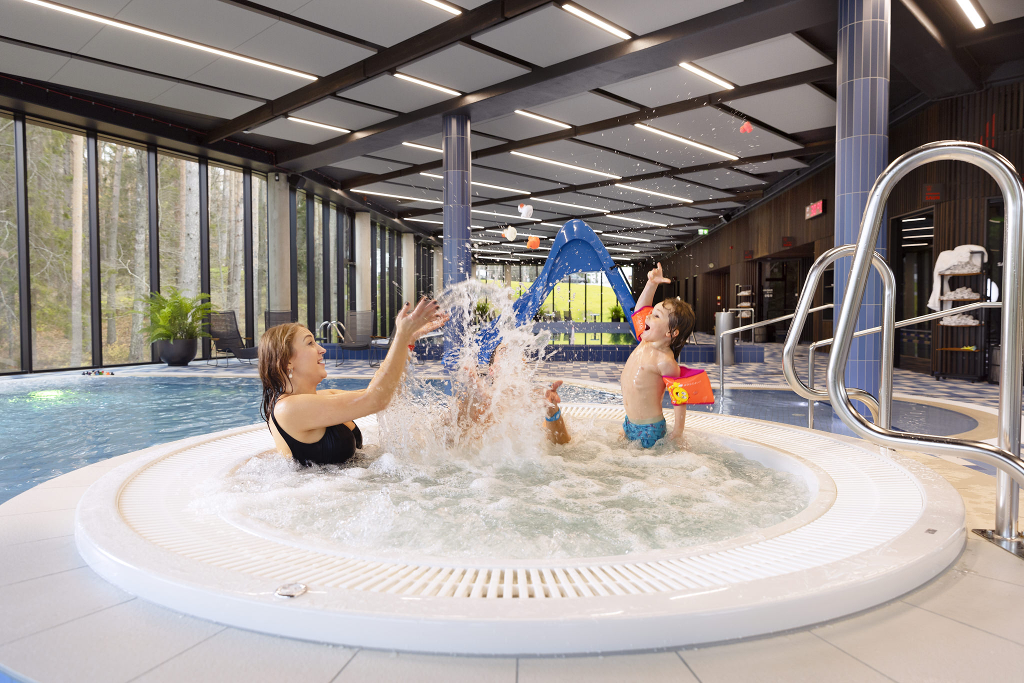 Children splashing in the water park pool in Central Estonia