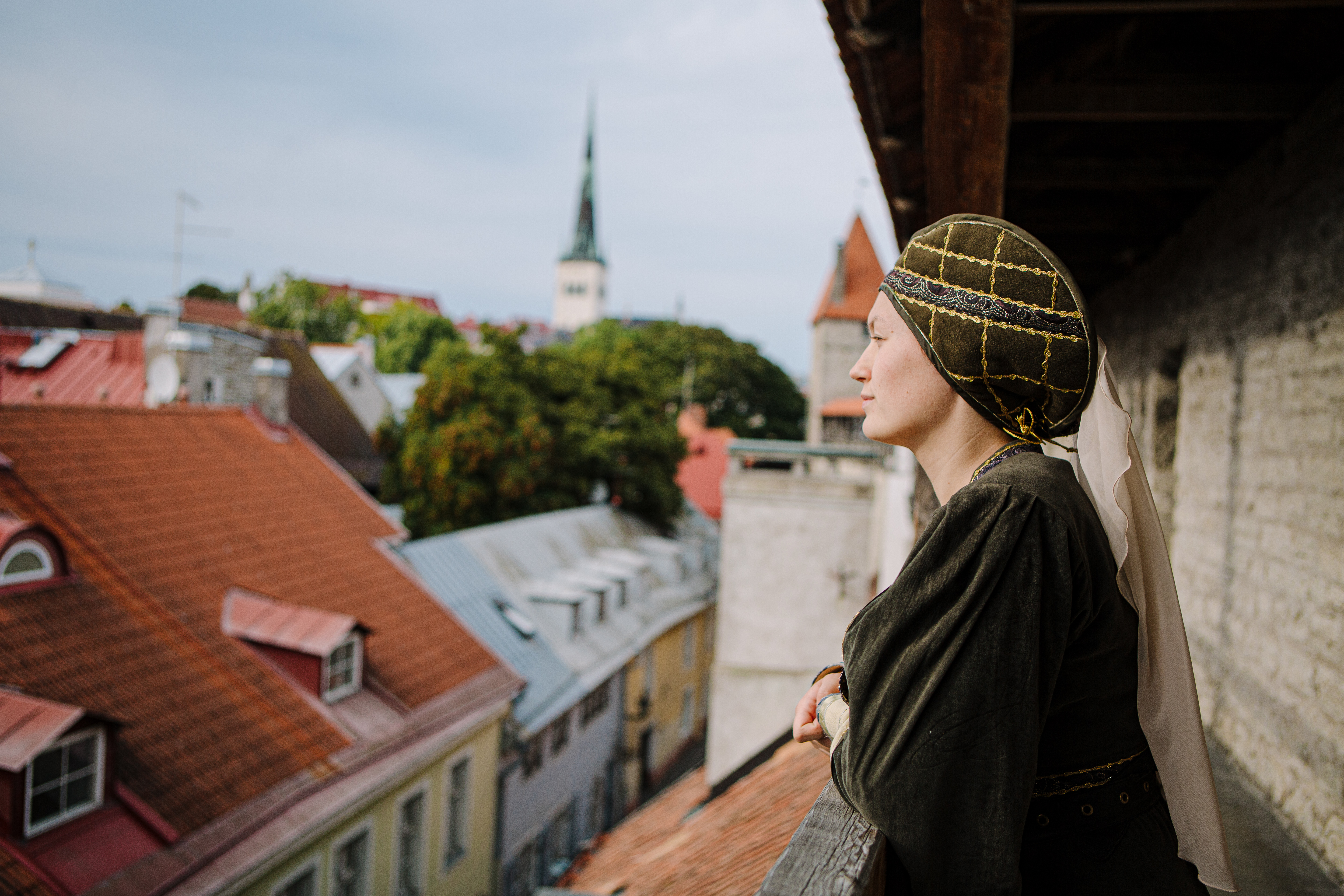 Woman in medieval clothing during tour of Estonian history in Tallinn