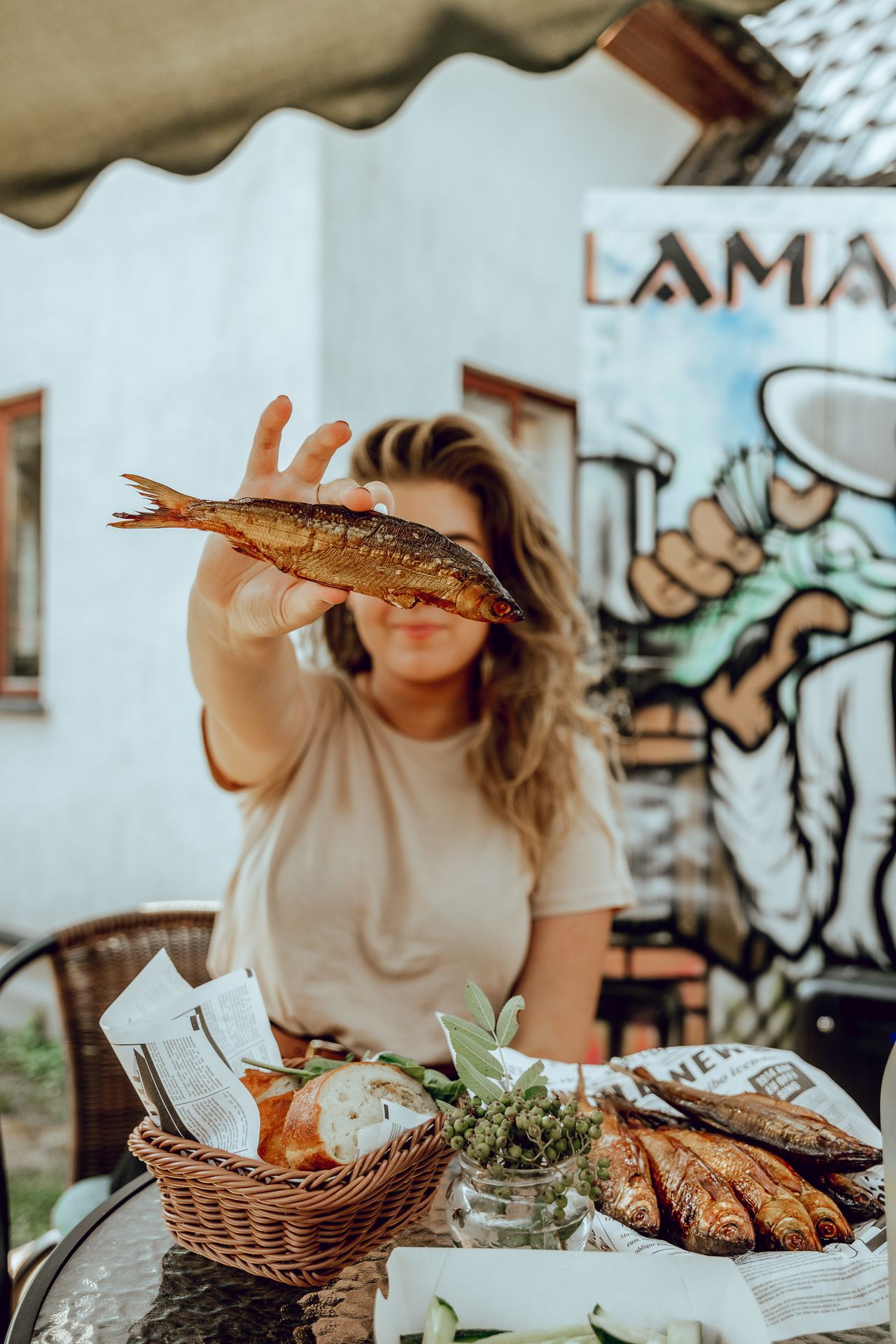 Woman holds fish caught in Lake Peipsi
