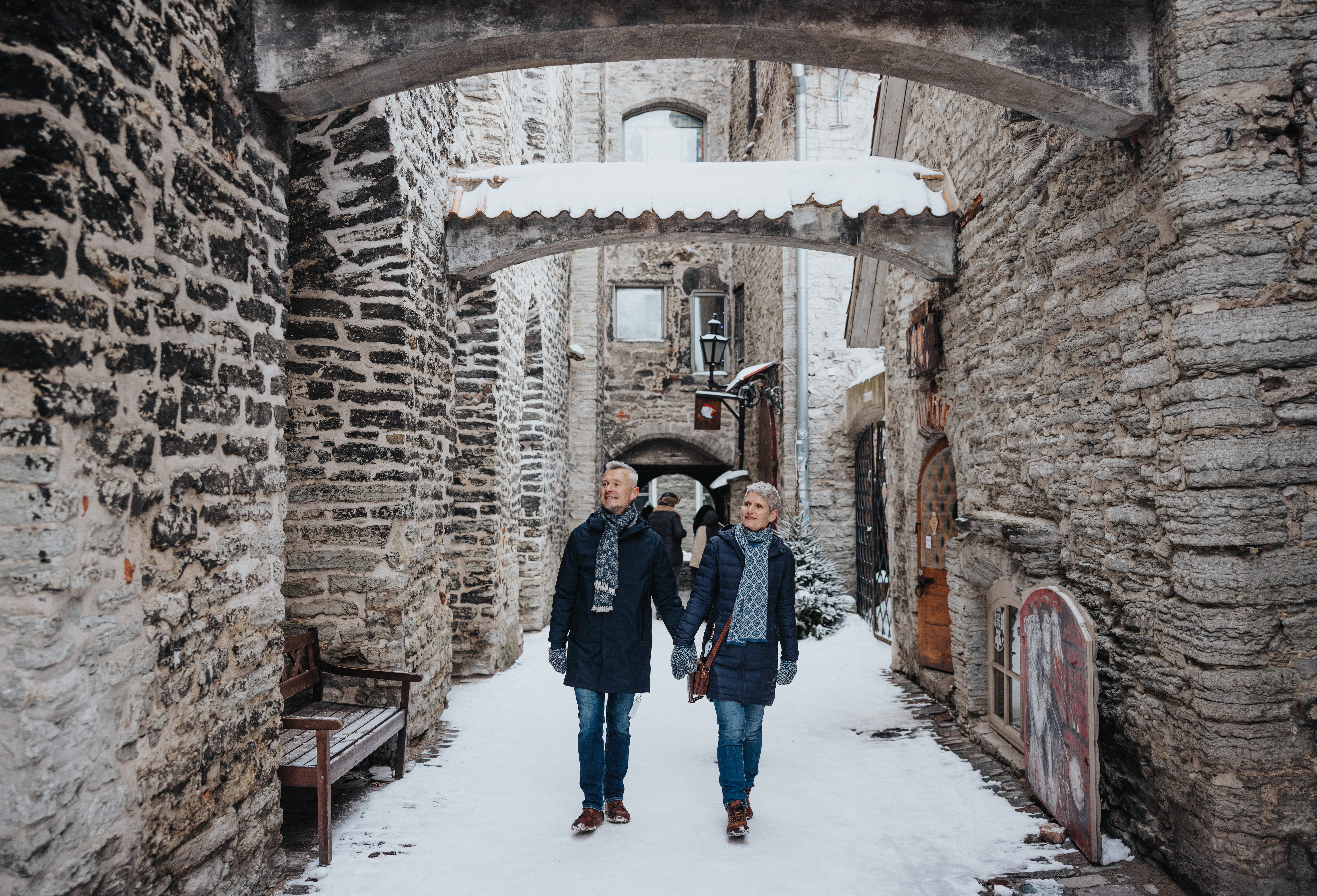 2 people walking at the old town