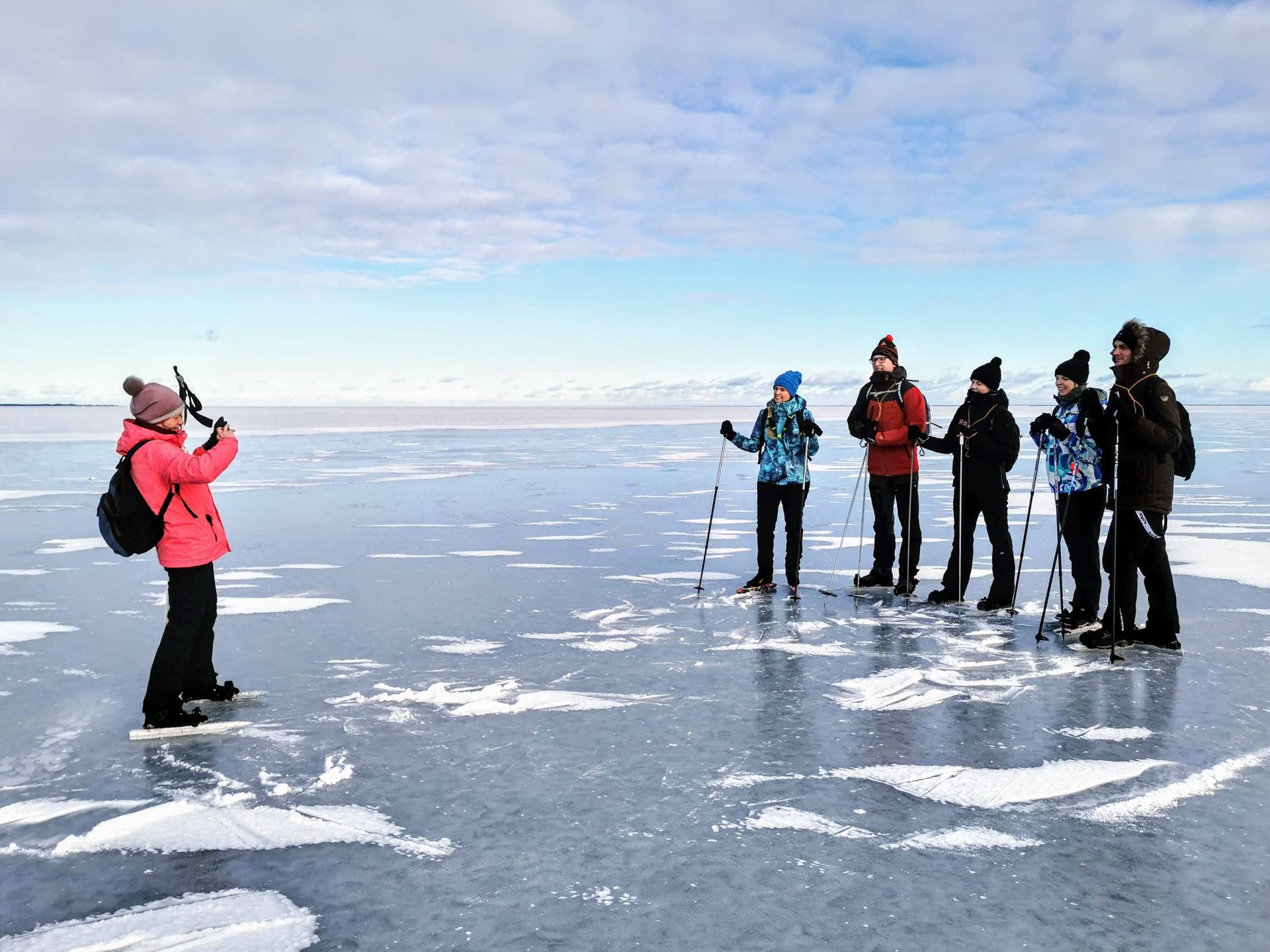 Group photo on tour skating trip on frozen Pärnu Bay in Estonia