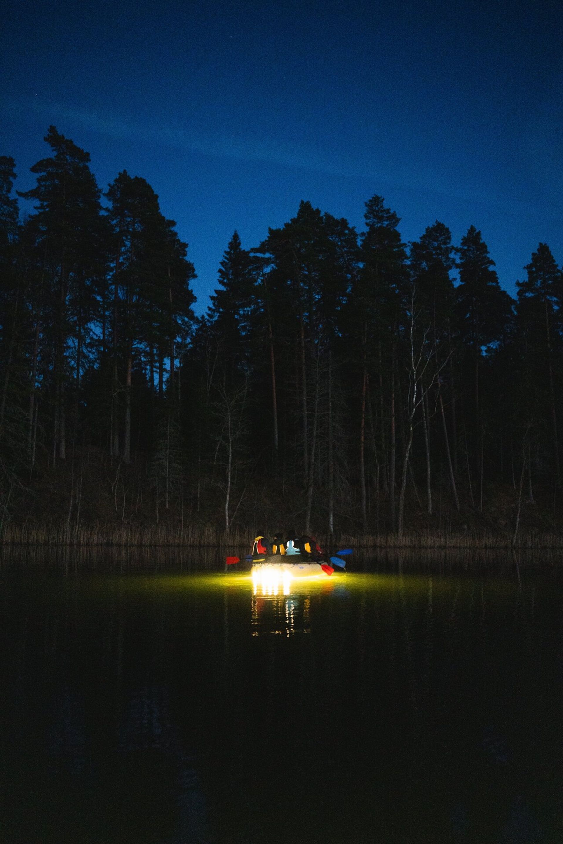 Lighted boat on a lake in Central Estonia