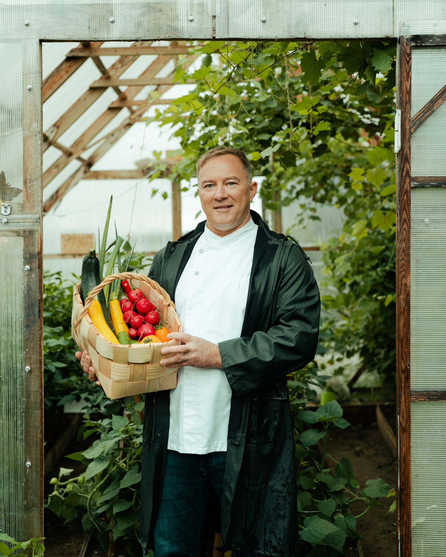 Chef and gardener with organic produce at a home restaurant in Estonia