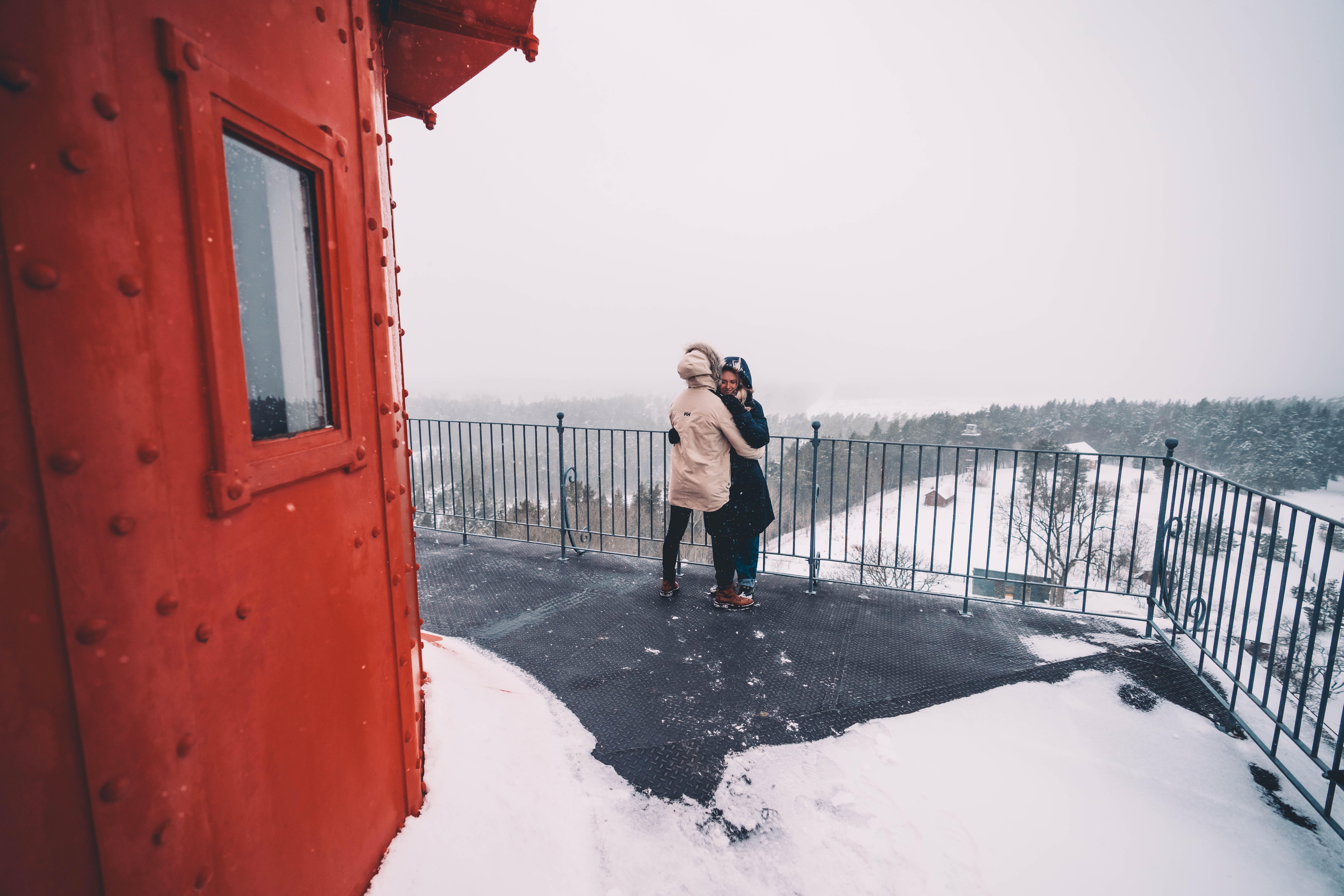 Man and woman embrace atop Kõpu Lighthouse on Hiiumaa