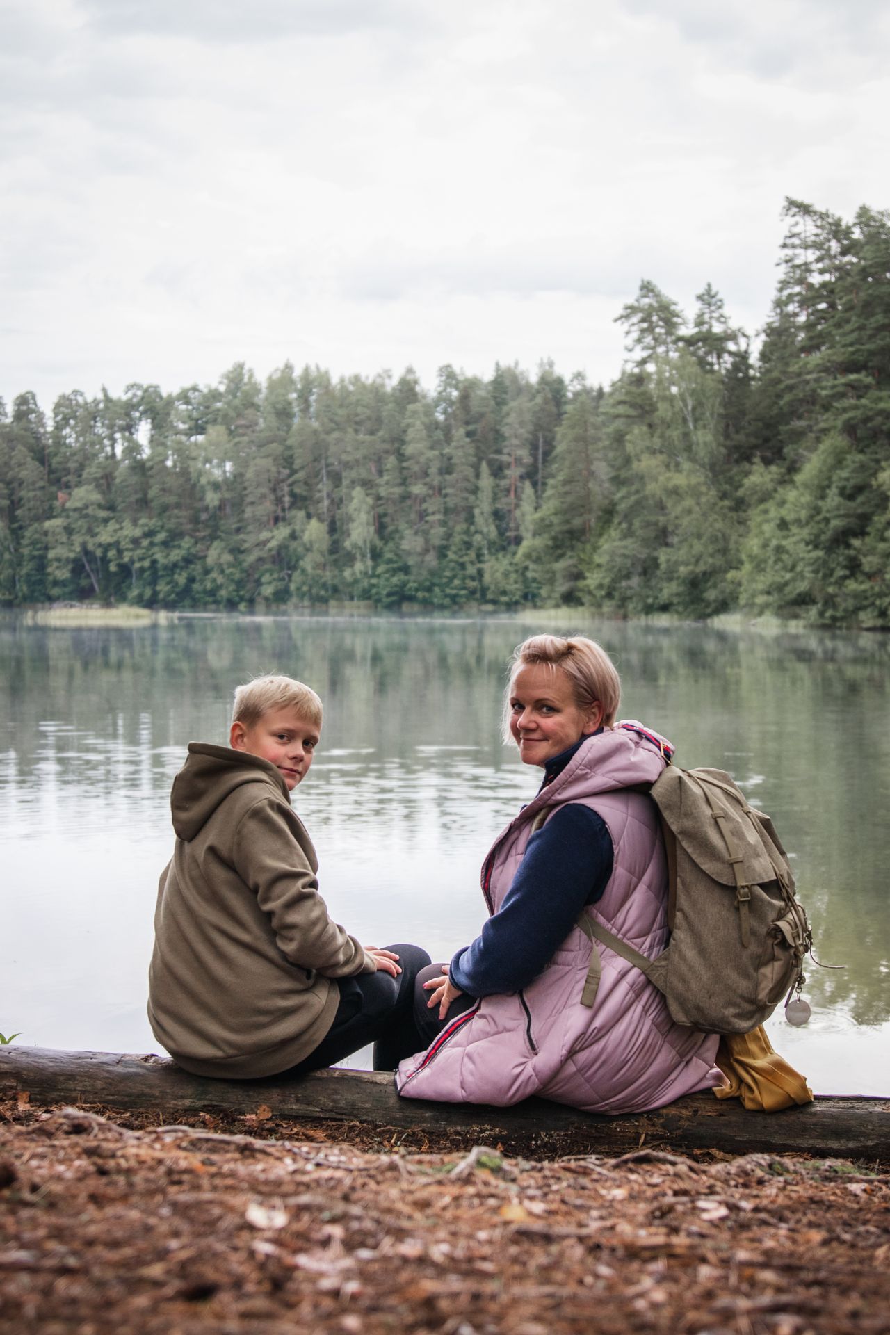 Children hiking near a bog lake in North Estonia