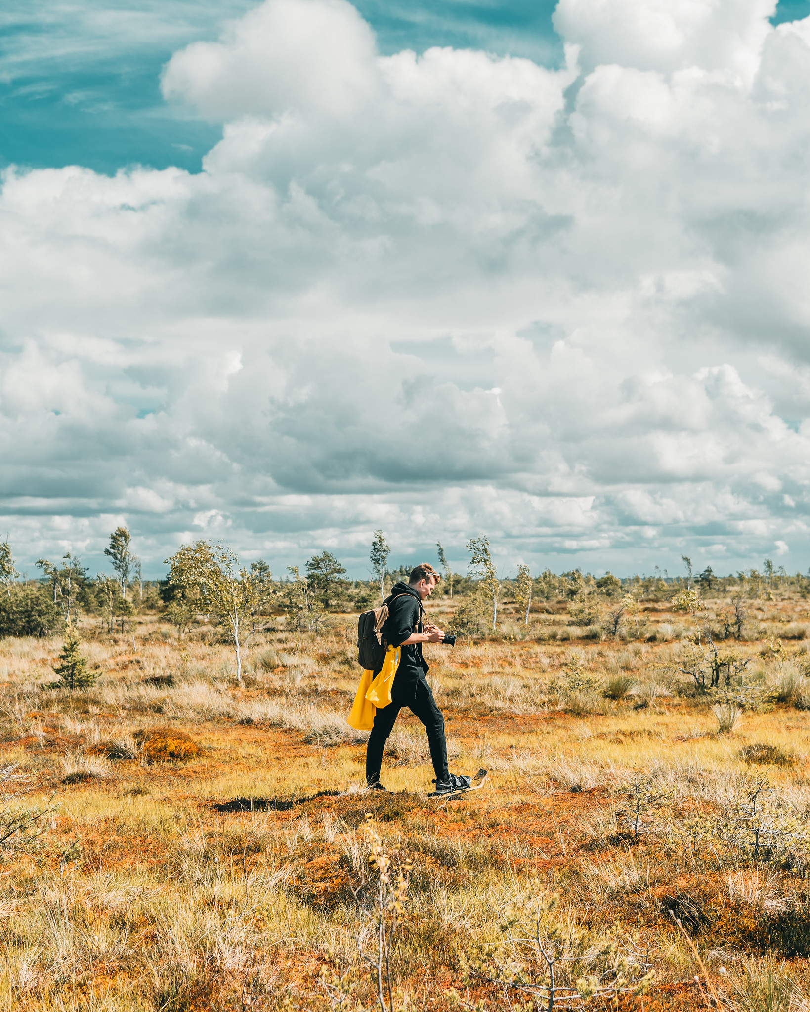 Photographer bogshoeing in Estonia