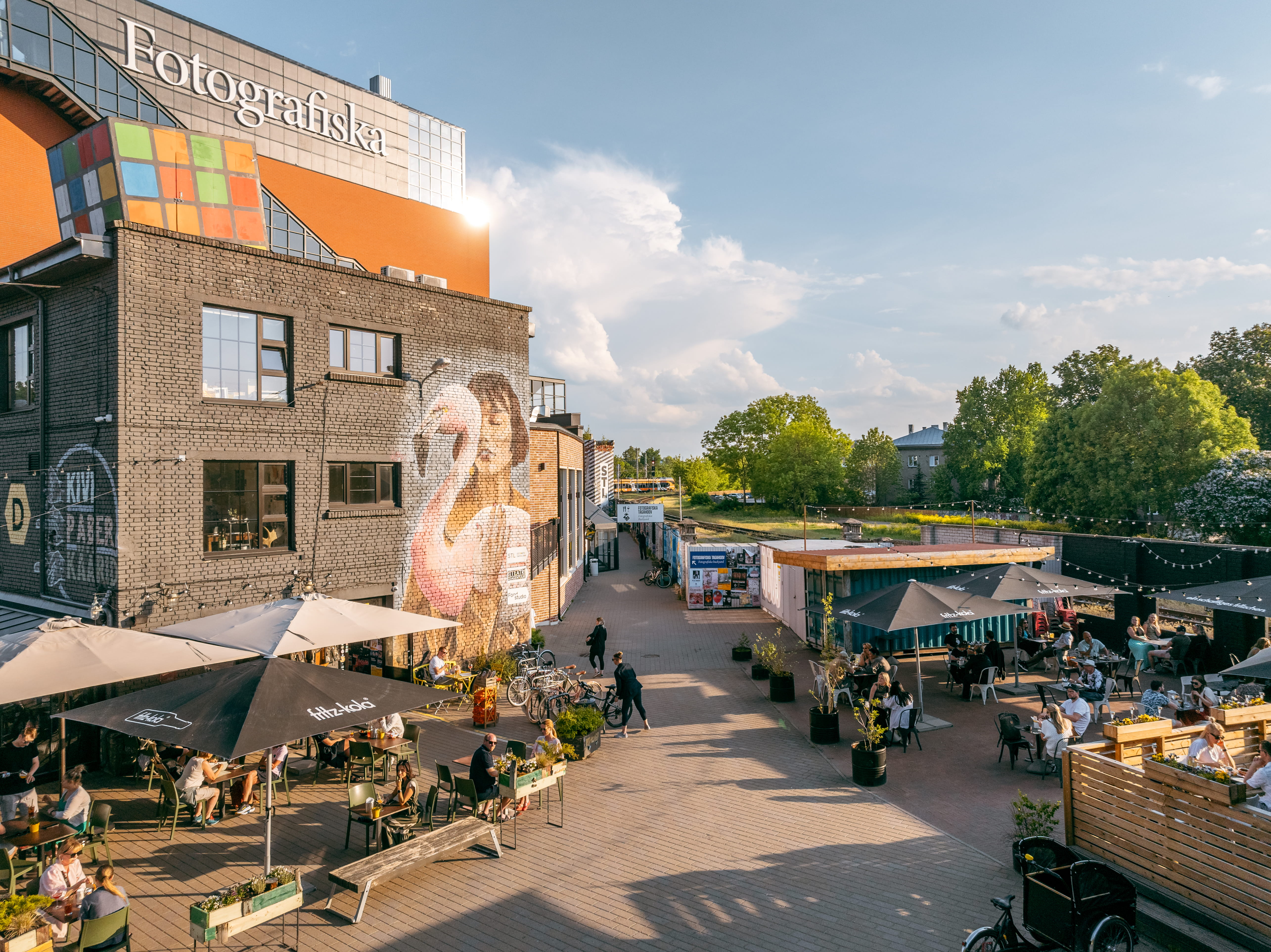 View of restaurants, street food, and outdoor seating in Telliskivi